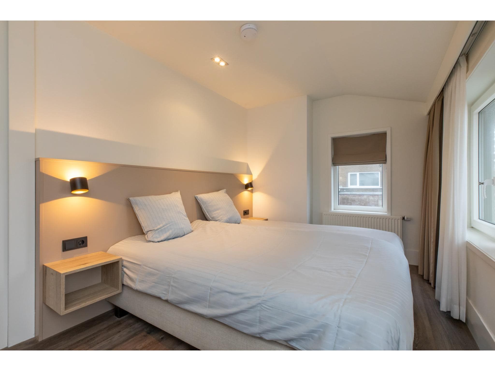 Een slaapkamer van Langstraat 5B in Zoutelande