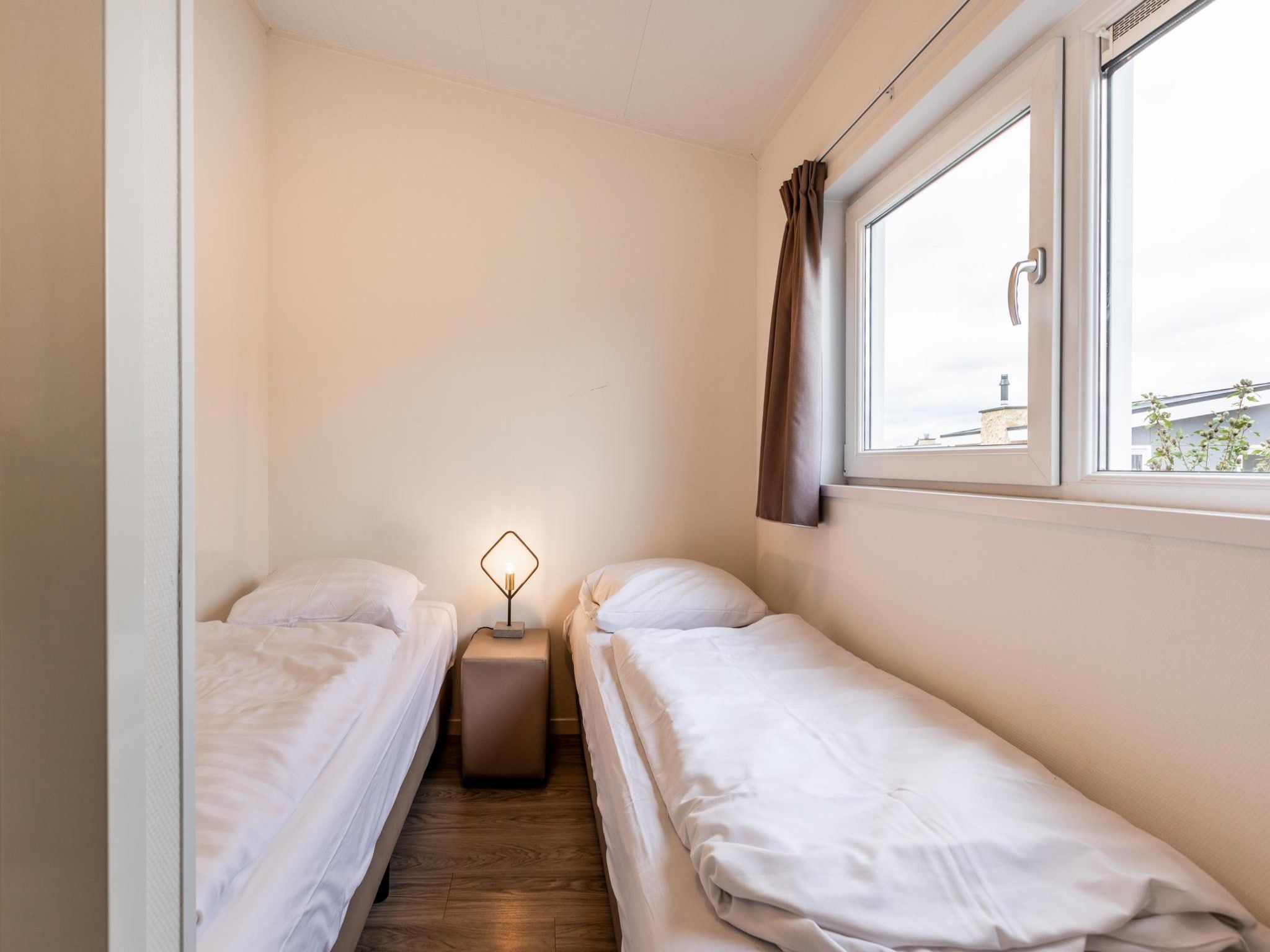 Een slaapkamer van Biebosch - Garden house in Bemelen