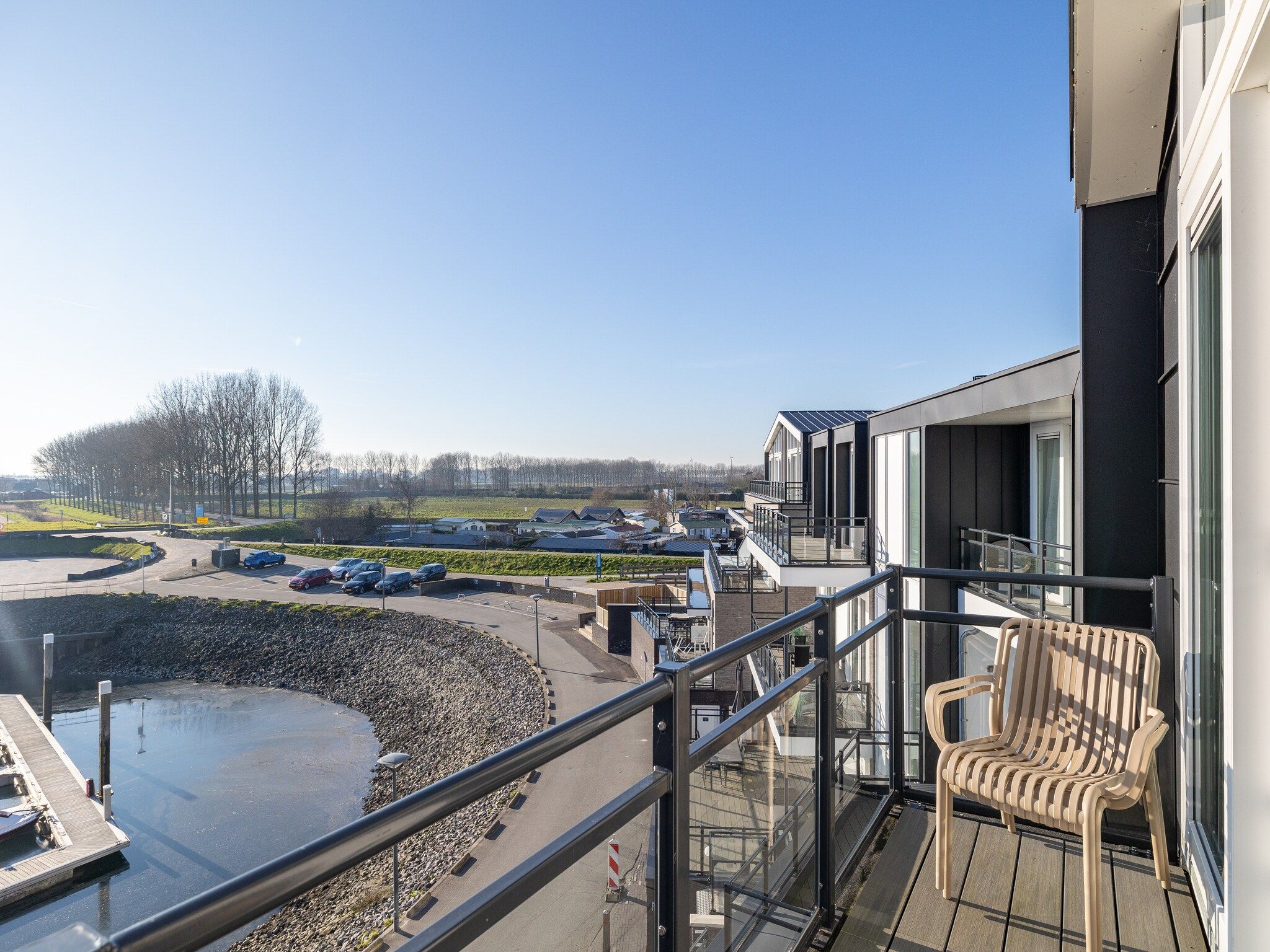 Het uitzicht vanaf Appartement Vista Maris 'Haus am See' - Havenweg 8-30  Sint-Annaland in Sint-Annaland