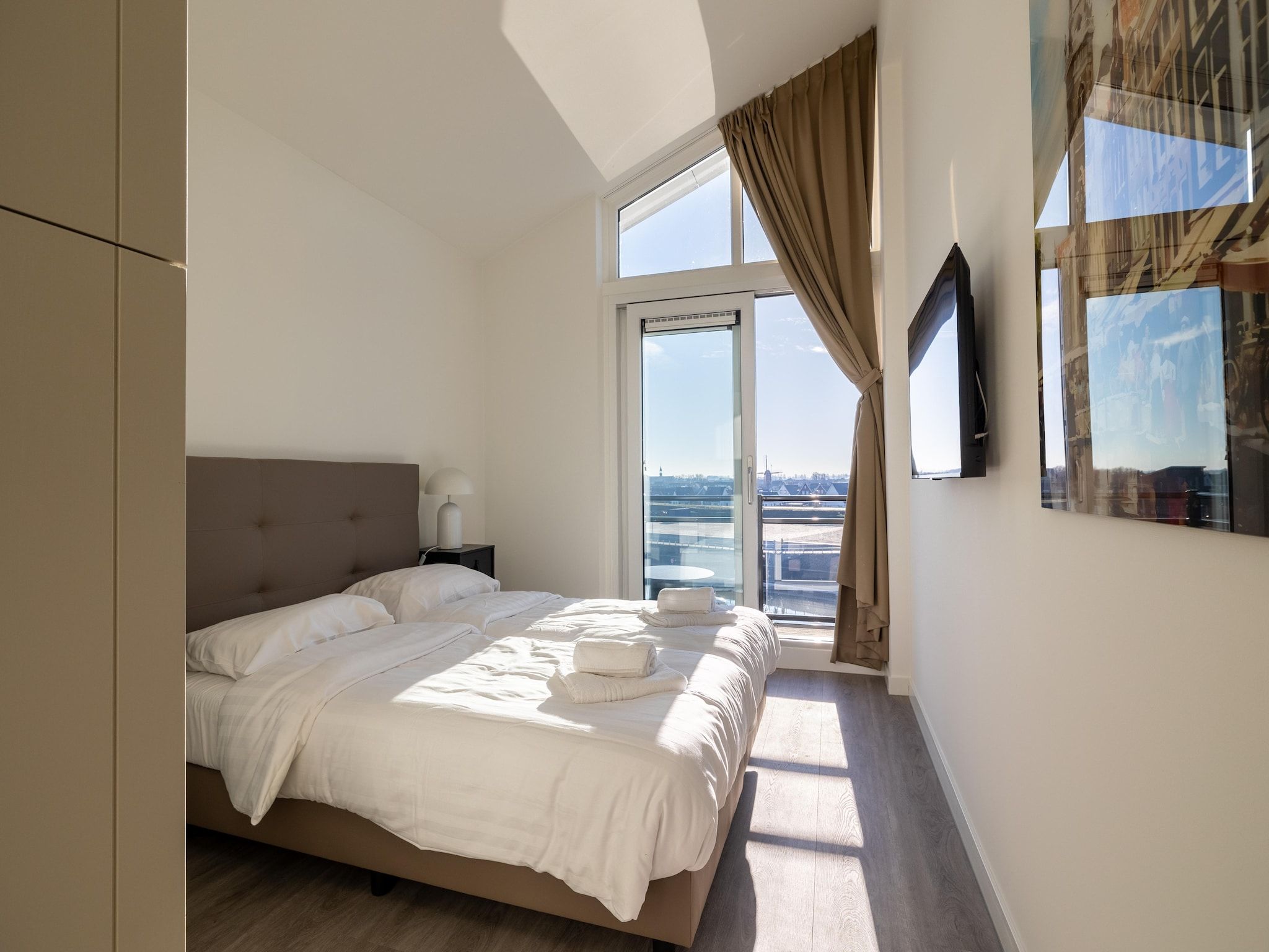 Een slaapkamer van Appartement Vista Maris 'Haus am See' - Havenweg 8-30  Sint-Annaland in Sint-Annaland