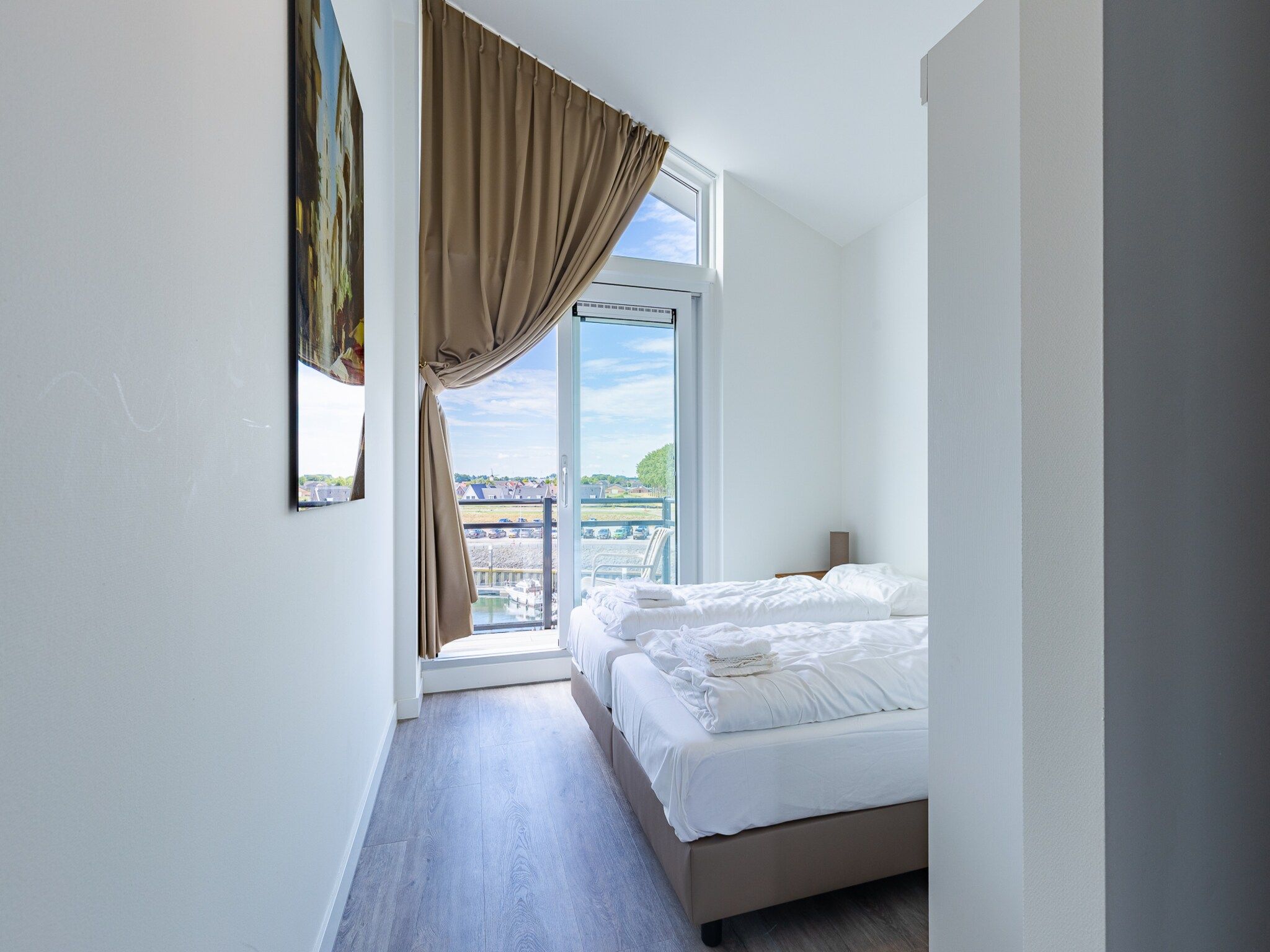 Een slaapkamer van Appartement Vista Maris 'Haus am See' - Havenweg 8-30  Sint-Annaland in Sint-Annaland