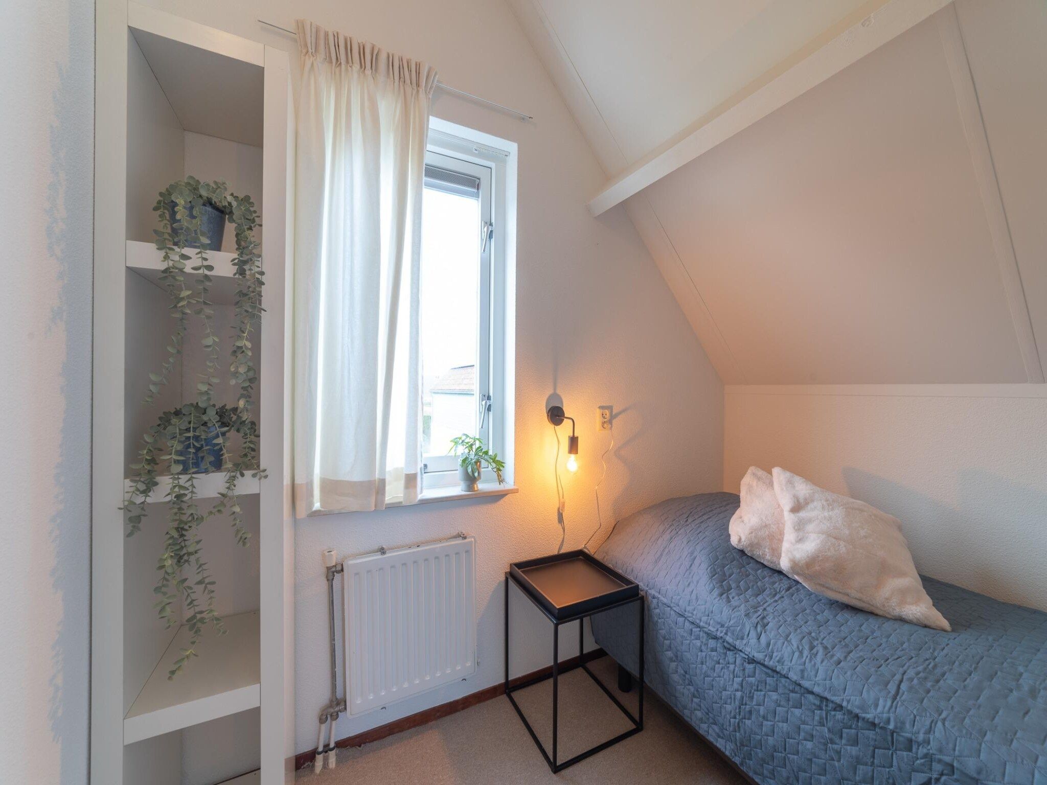 Een slaapkamer van Villapark De Oesterbaai 63 in Wemeldinge