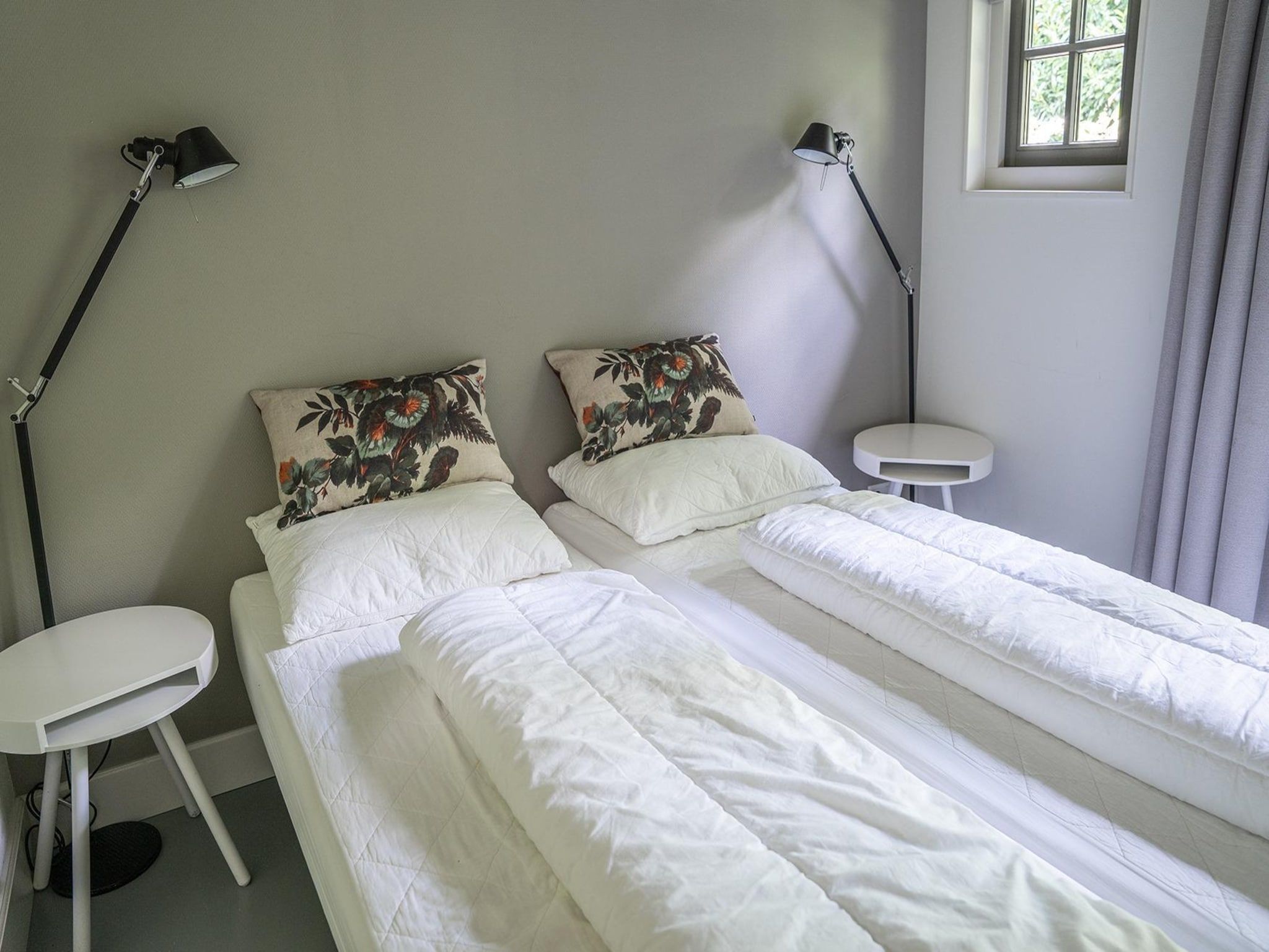 Een slaapkamer van Vlindervallei Villa 8p in Ermelo