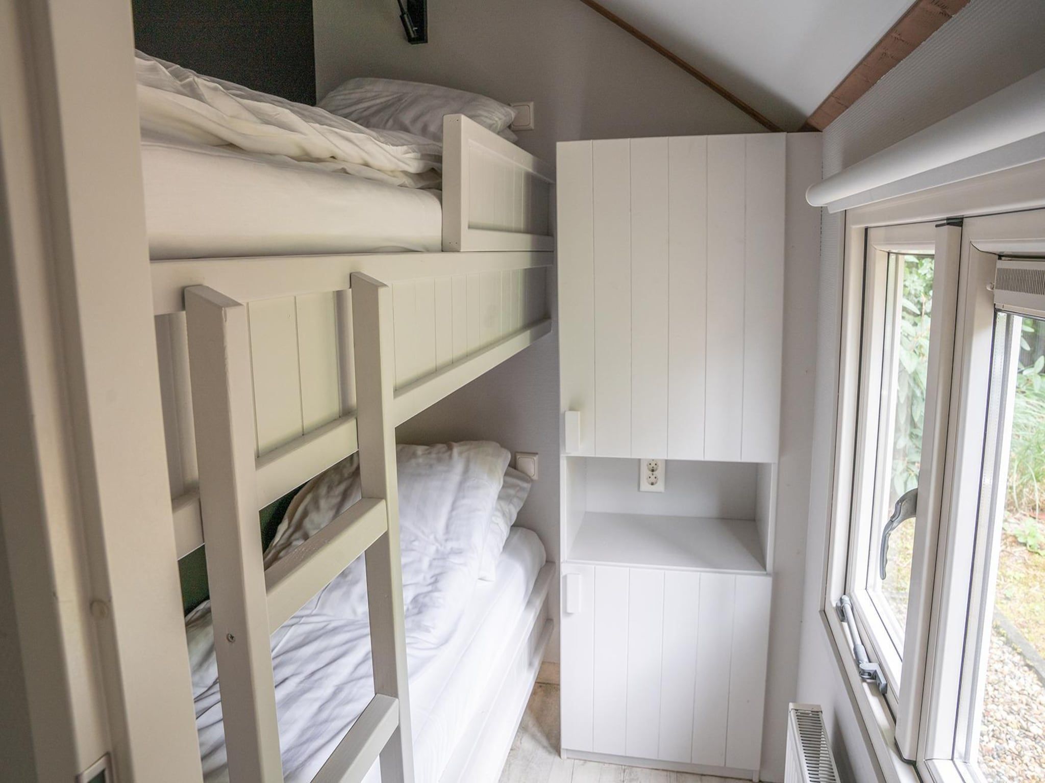Een slaapkamer van Heivlinder Comfort 4+2p in Ermelo