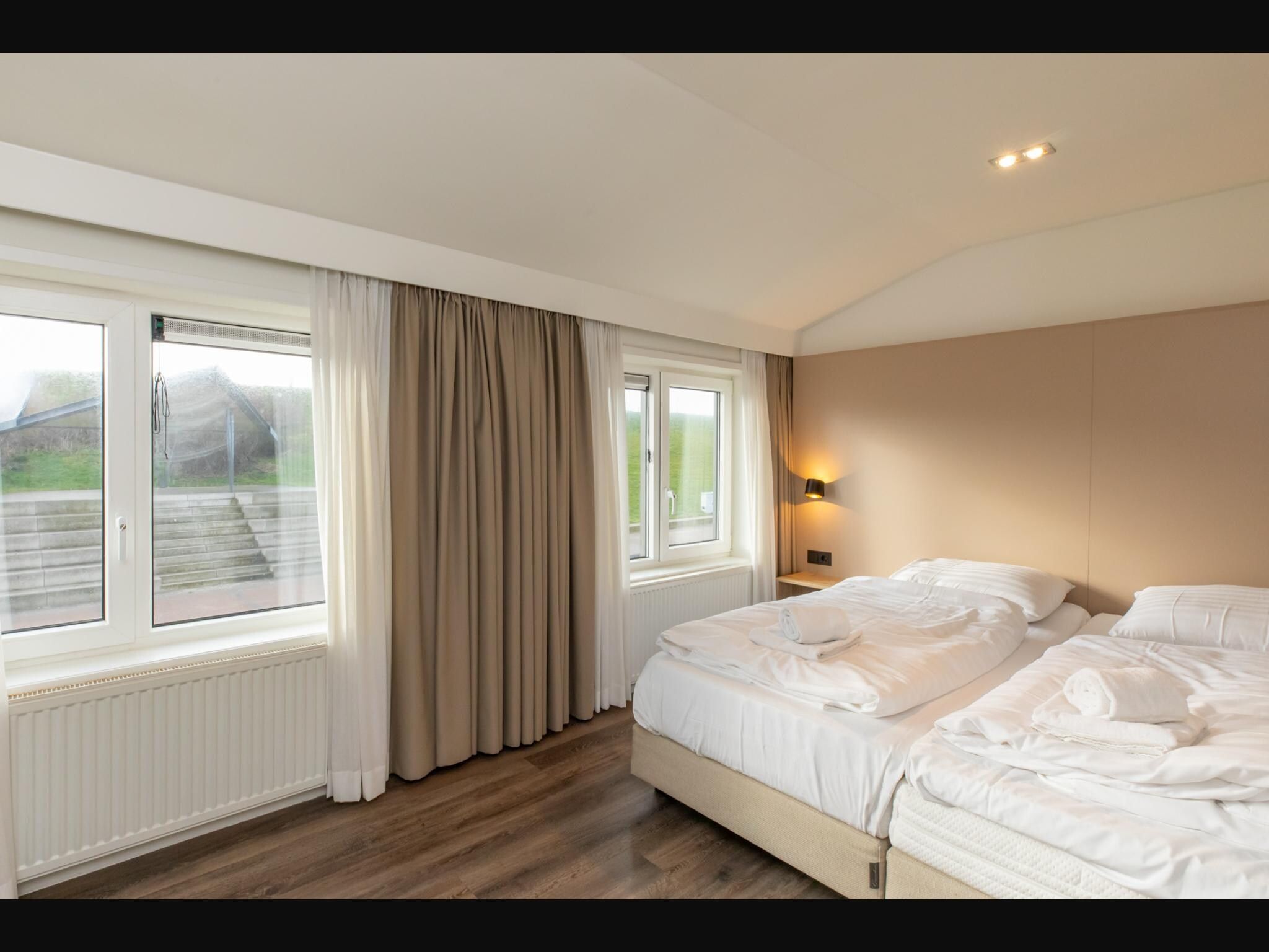 Een slaapkamer van Overnachten in Zoutelande  Comfortabel Appartement Langstraat 5A in Zoutelande