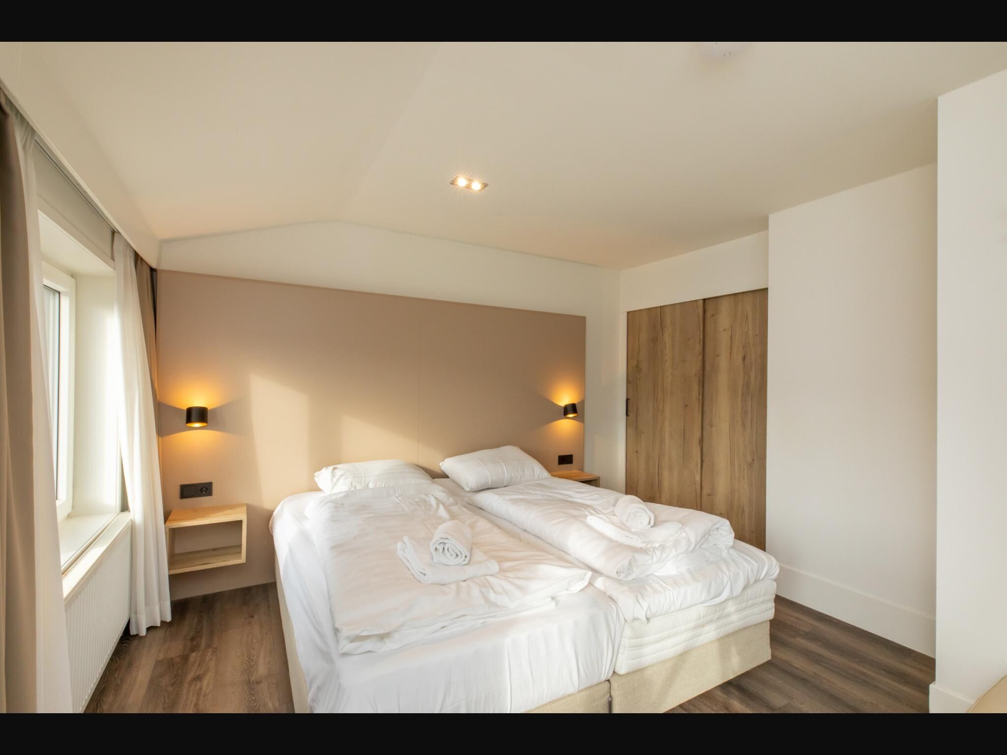 Een slaapkamer van Overnachten in Zoutelande  Comfortabel Appartement Langstraat 5A in Zoutelande
