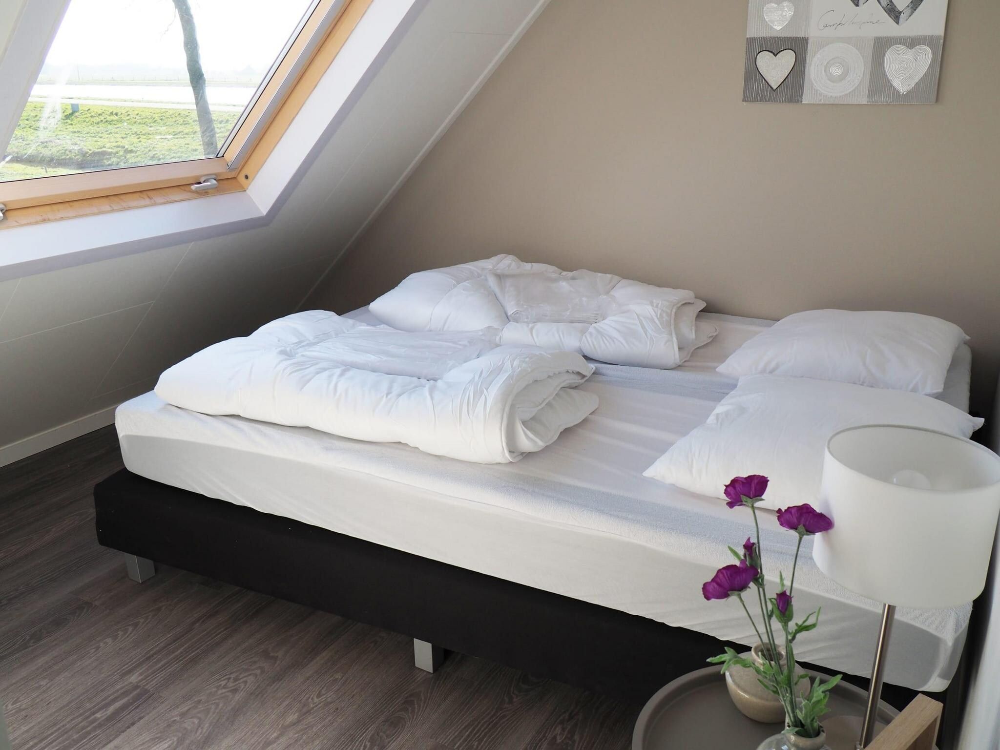 Een slaapkamer van Tulpenhof Villa  10 personen in West-Graftdijk