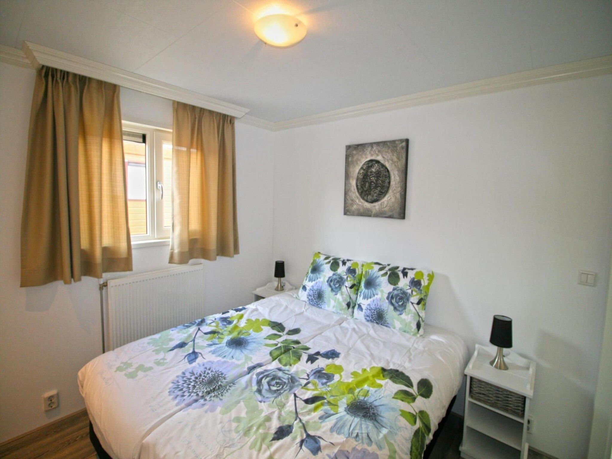 Een slaapkamer van Tulpenhof met sauna  6 personen in West-Graftdijk