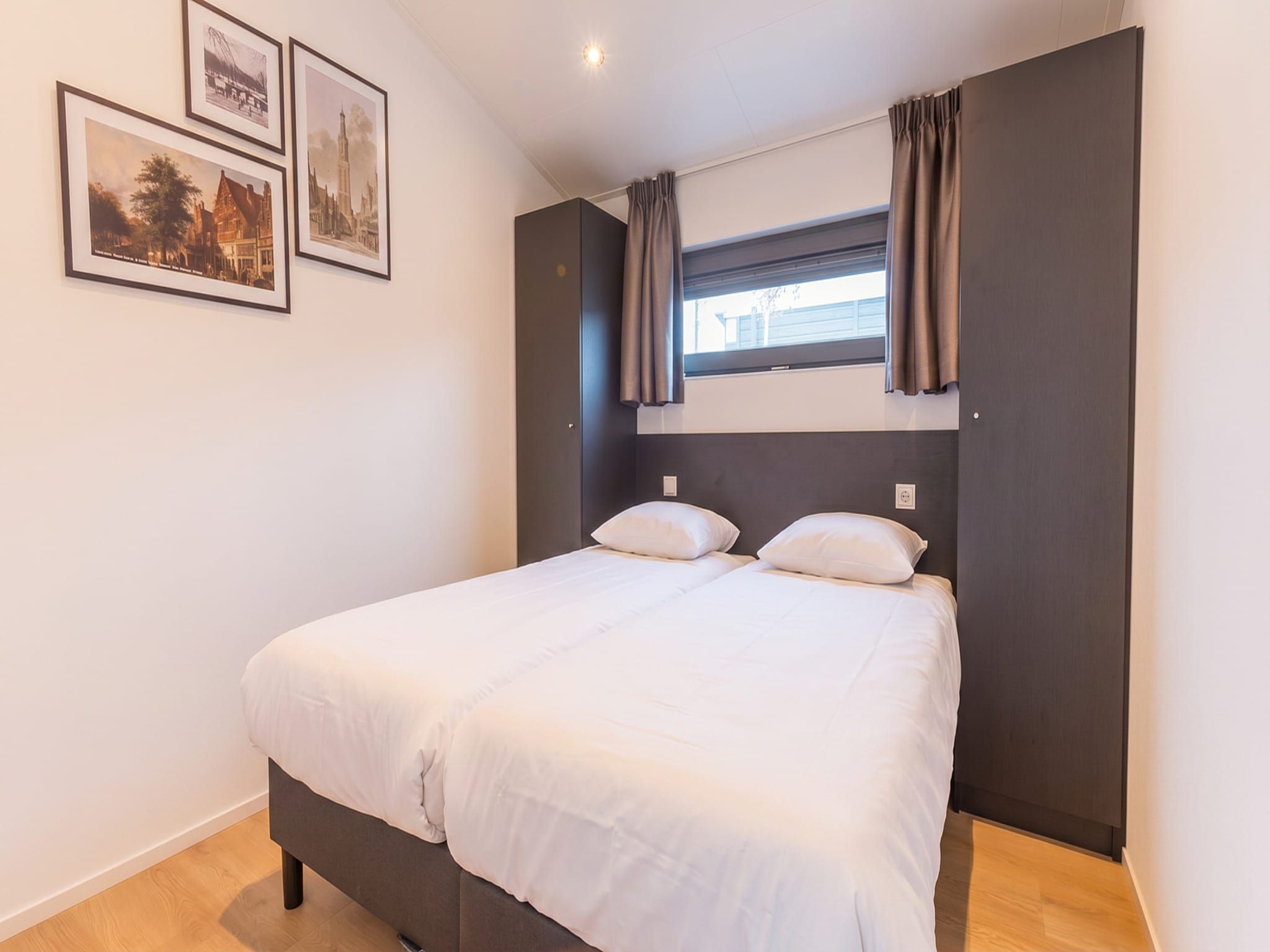 Een slaapkamer van Cube Split Culinair Wellness 6 in Enkhuizen