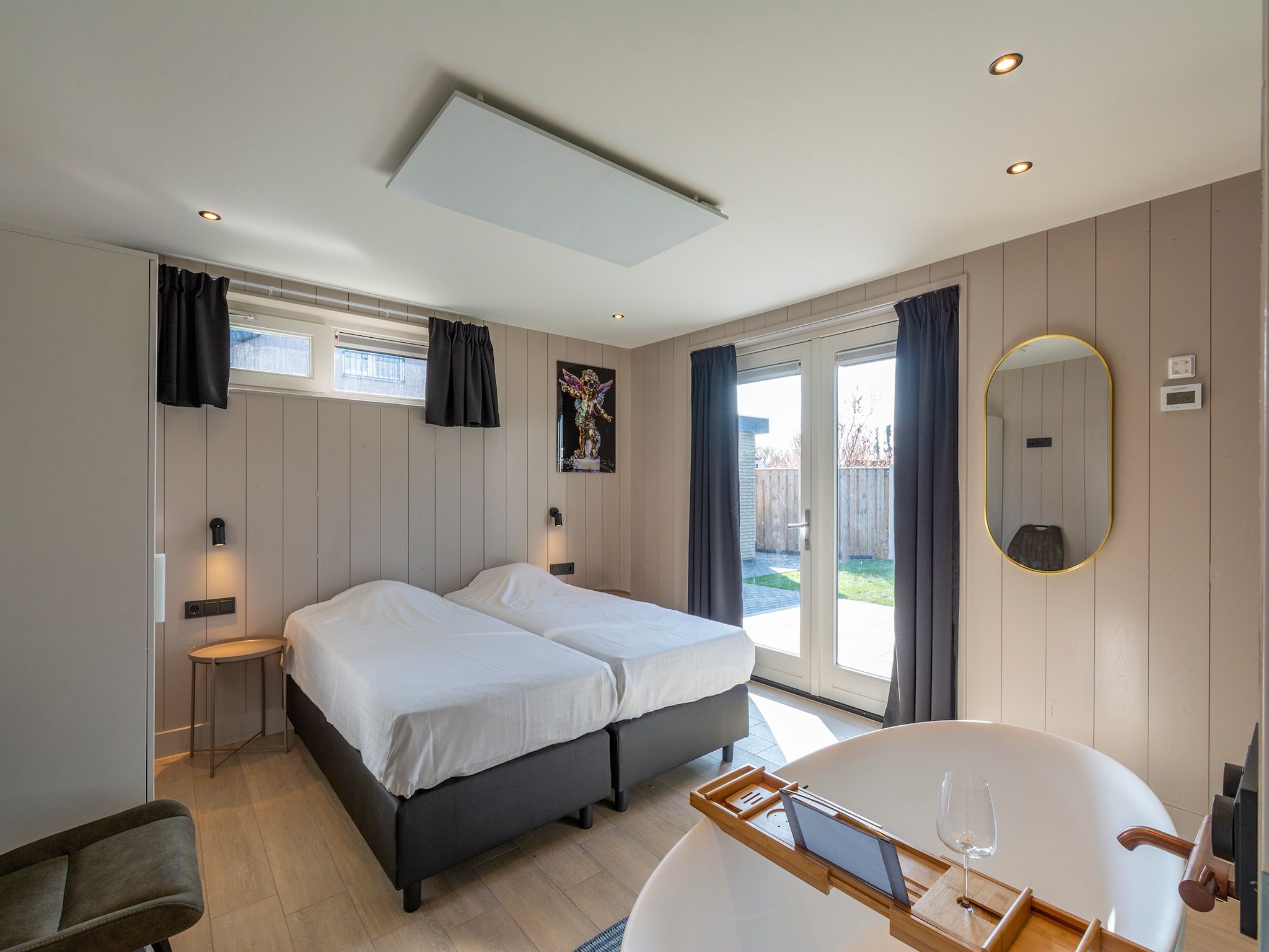 Een slaapkamer van Wellness Villa Azure in Julianadorp