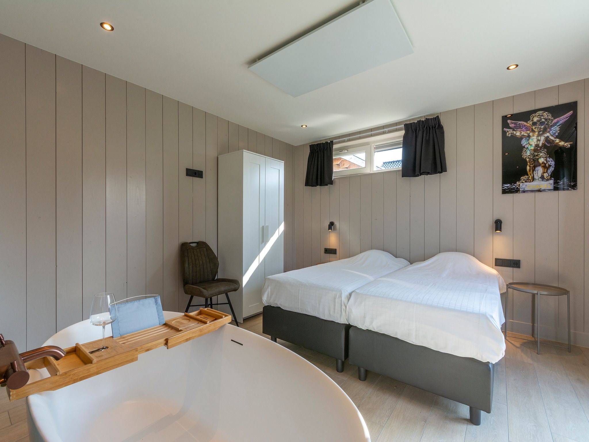 Een slaapkamer van Wellness Villa Azure in Julianadorp