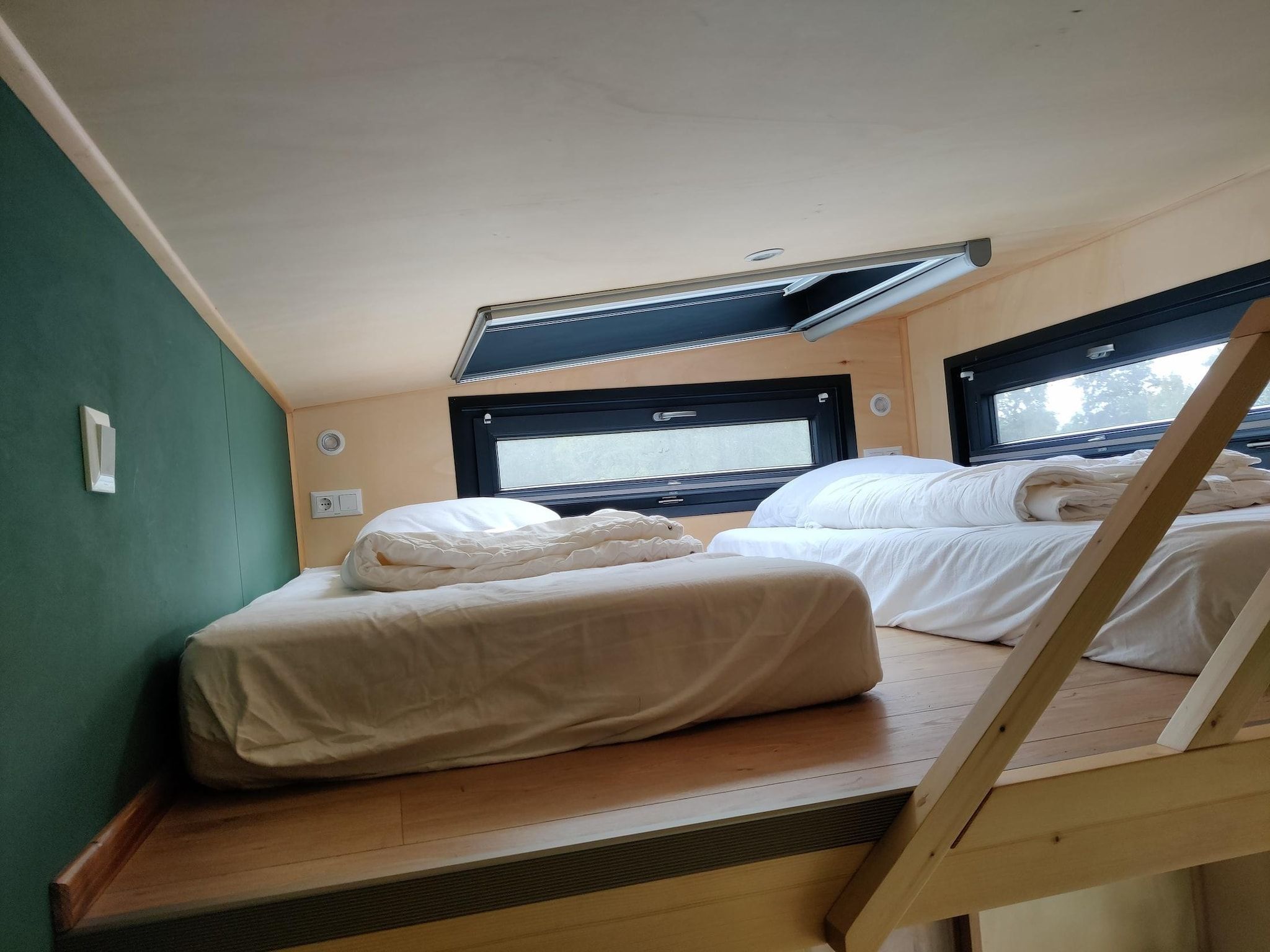 Een slaapkamer van Tiny house voor 2  2 personen in Scherpenzeel