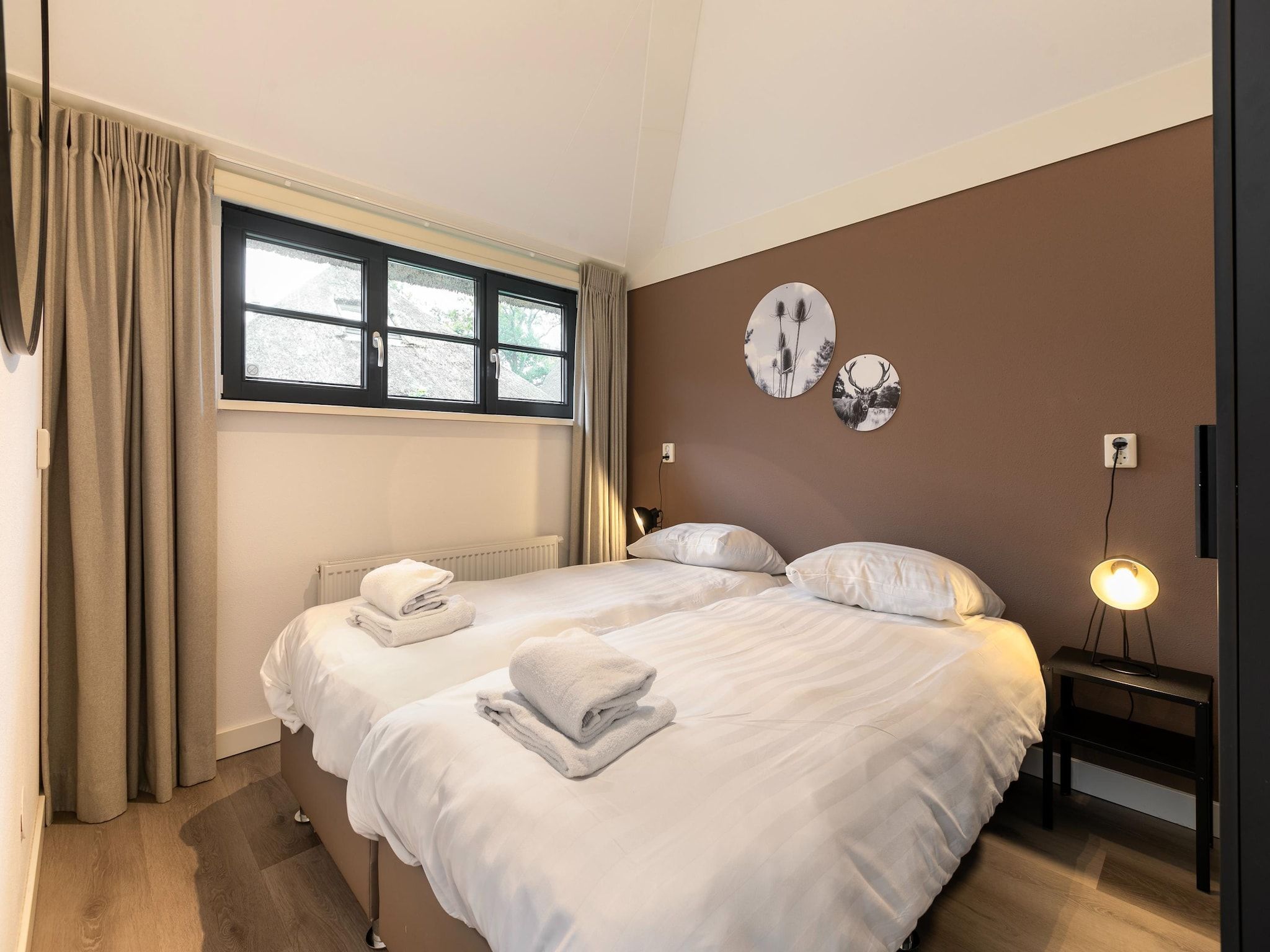 Een slaapkamer van Buitenhuis Wellness in Schoorl