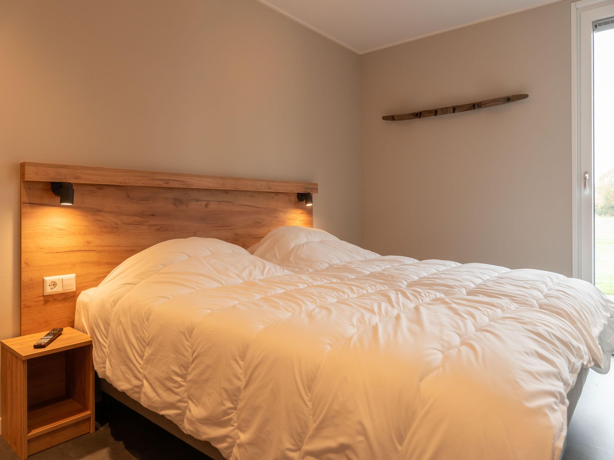 Een slaapkamer van Yn 't Bosk in Sint Nicolaasga