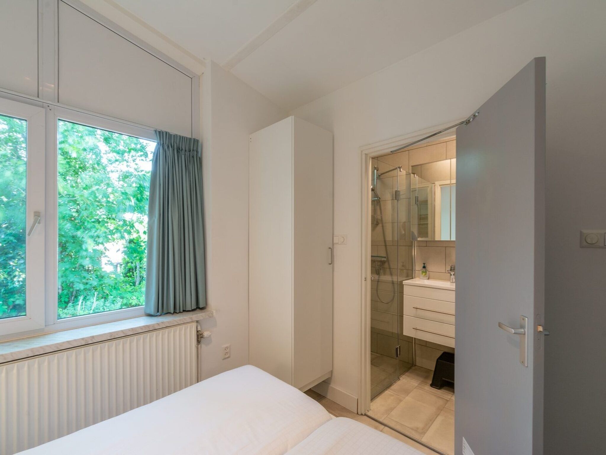 Een slaapkamer van Duinland 65 in Sint Maartenszee