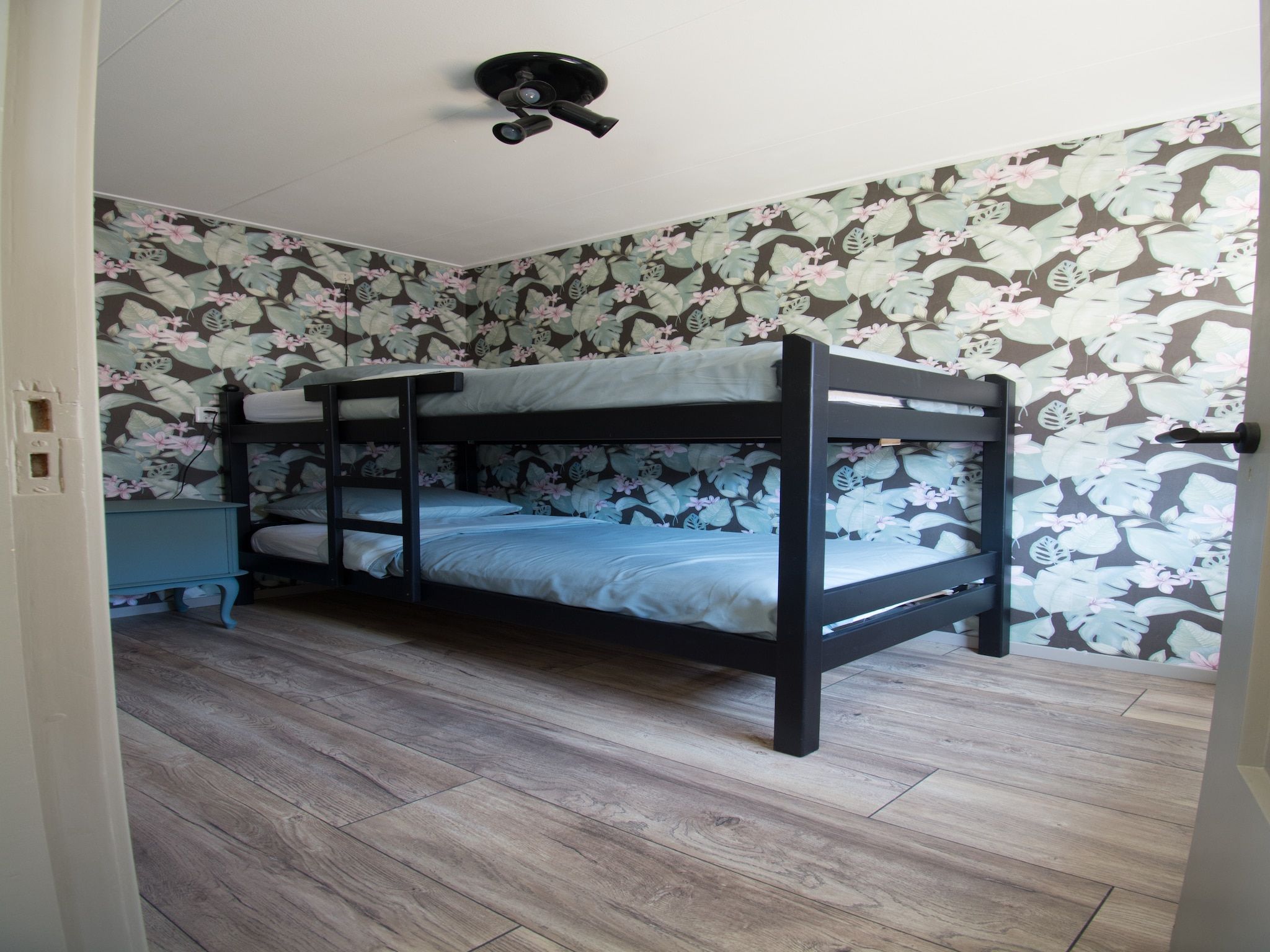Een slaapkamer van Bungalow Mui aan Zee in Petten