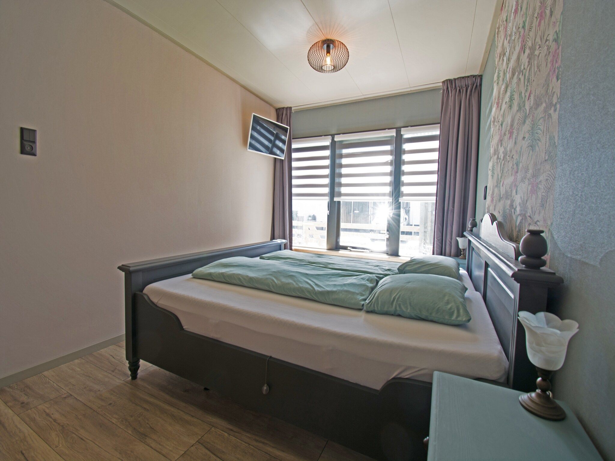 Een slaapkamer van Bungalow Mui aan Zee in Petten