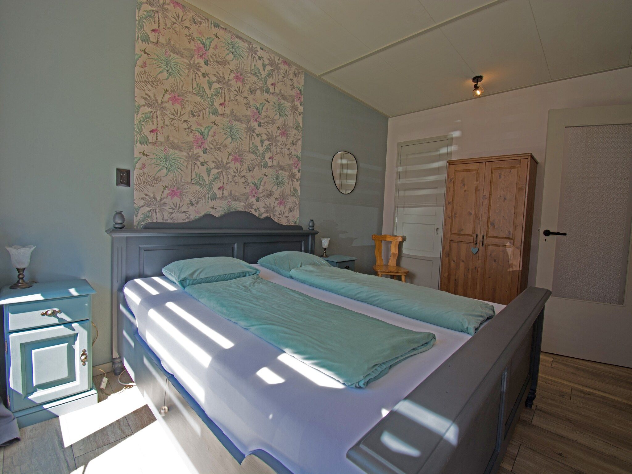 Een slaapkamer van Bungalow Mui aan Zee in Petten