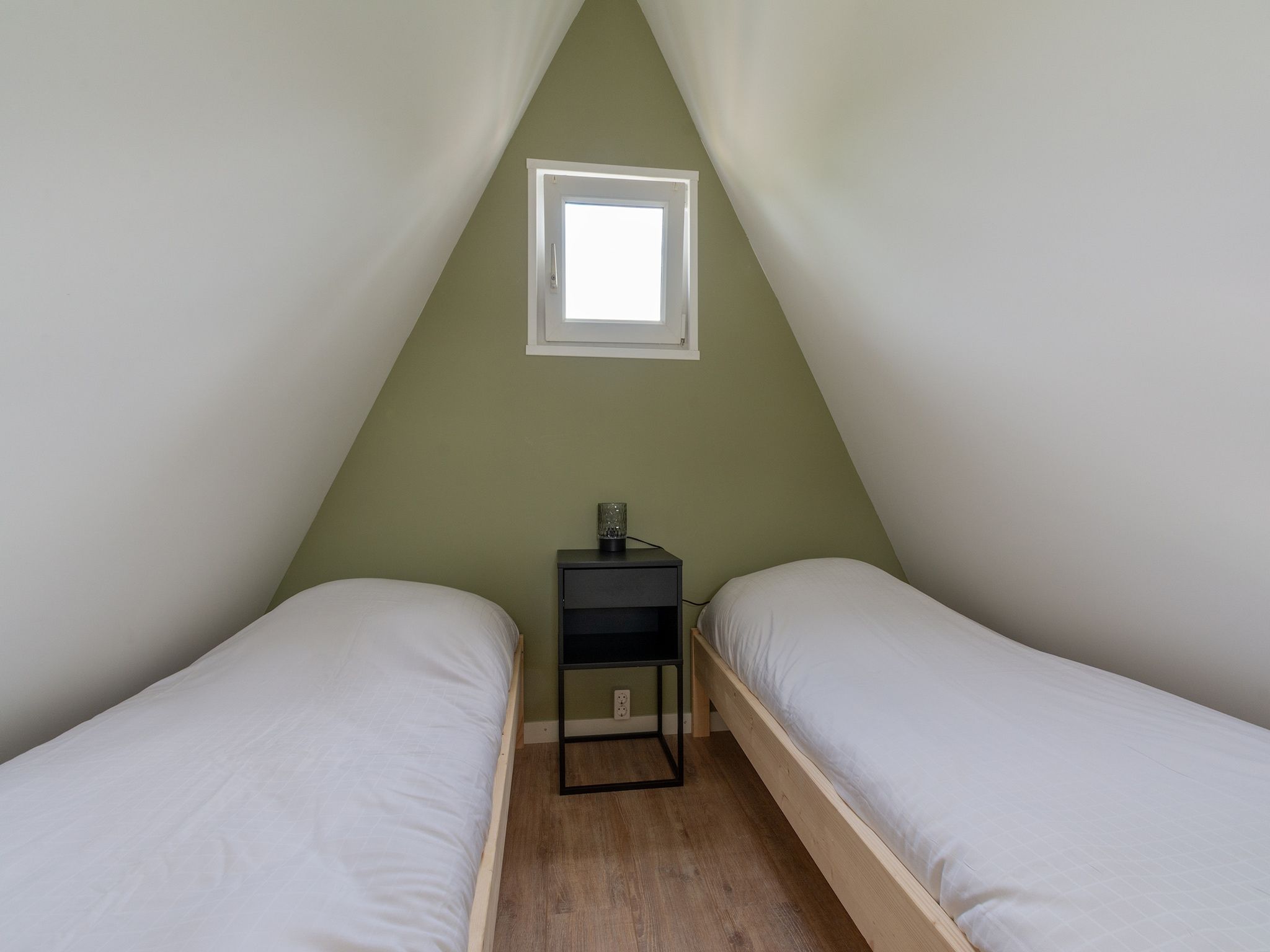 Een slaapkamer van Duinland 50 in Sint Maartenszee