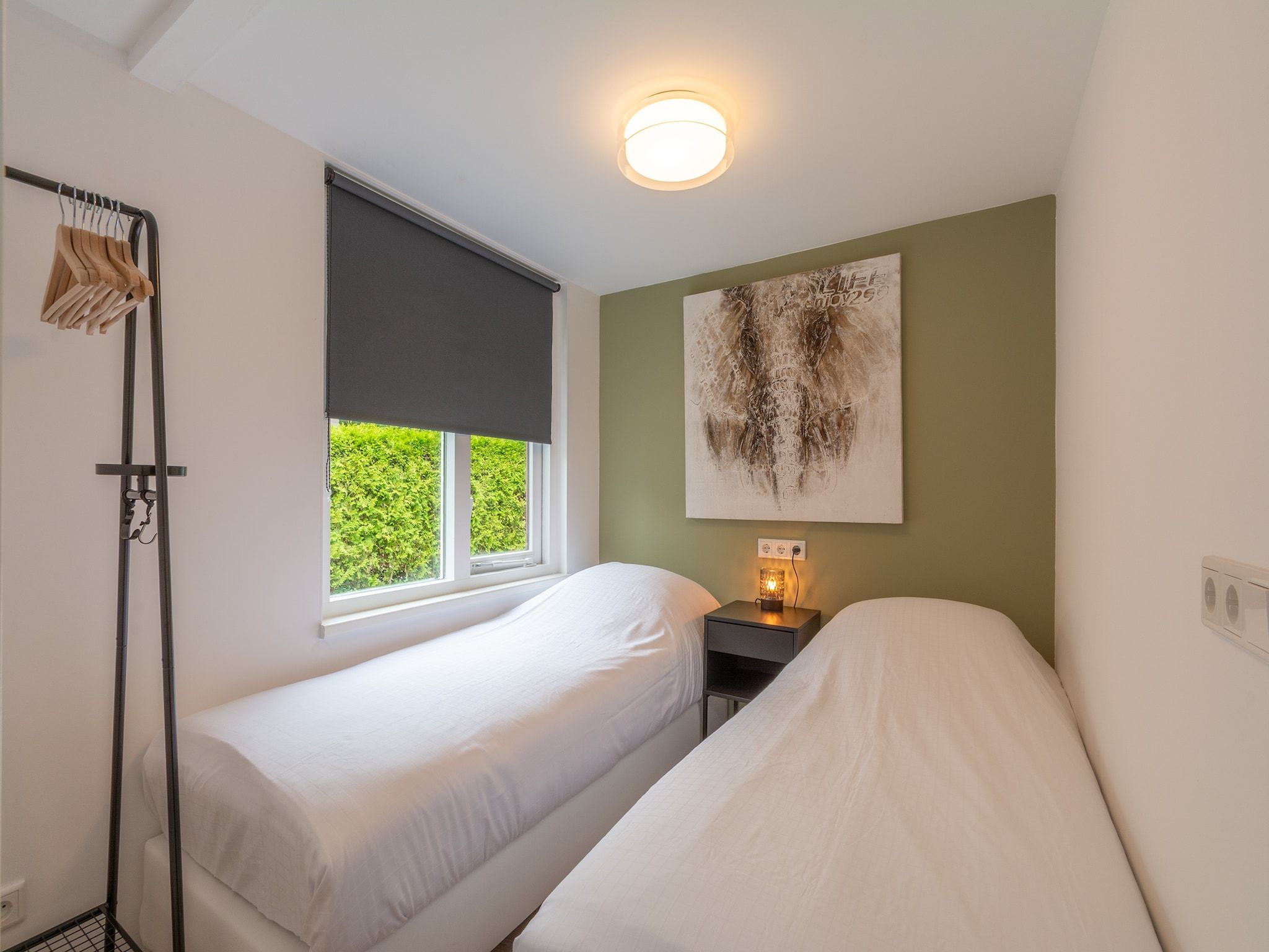 Een slaapkamer van Duinland 50 in Sint Maartenszee