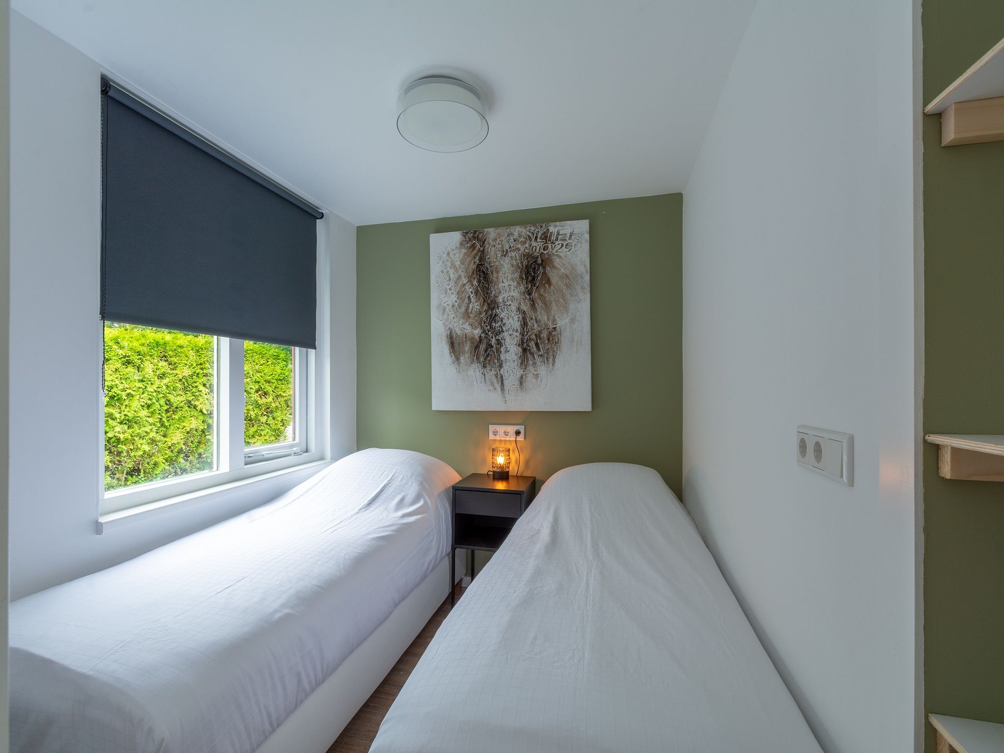 Een slaapkamer van Duinland 50 in Sint Maartenszee