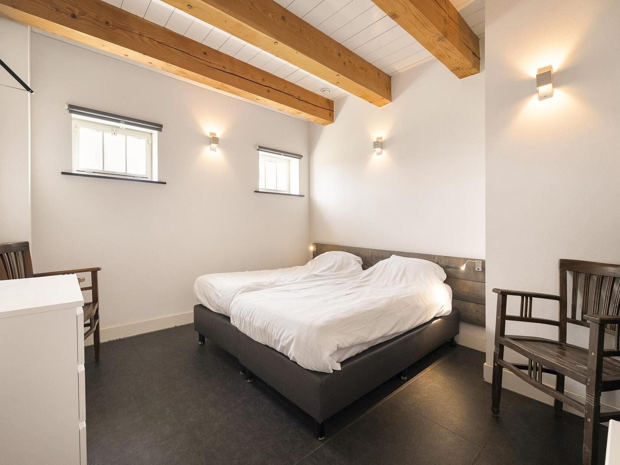 Een slaapkamer van Groepsaccomodatie - Balkenhoeve in Schagen