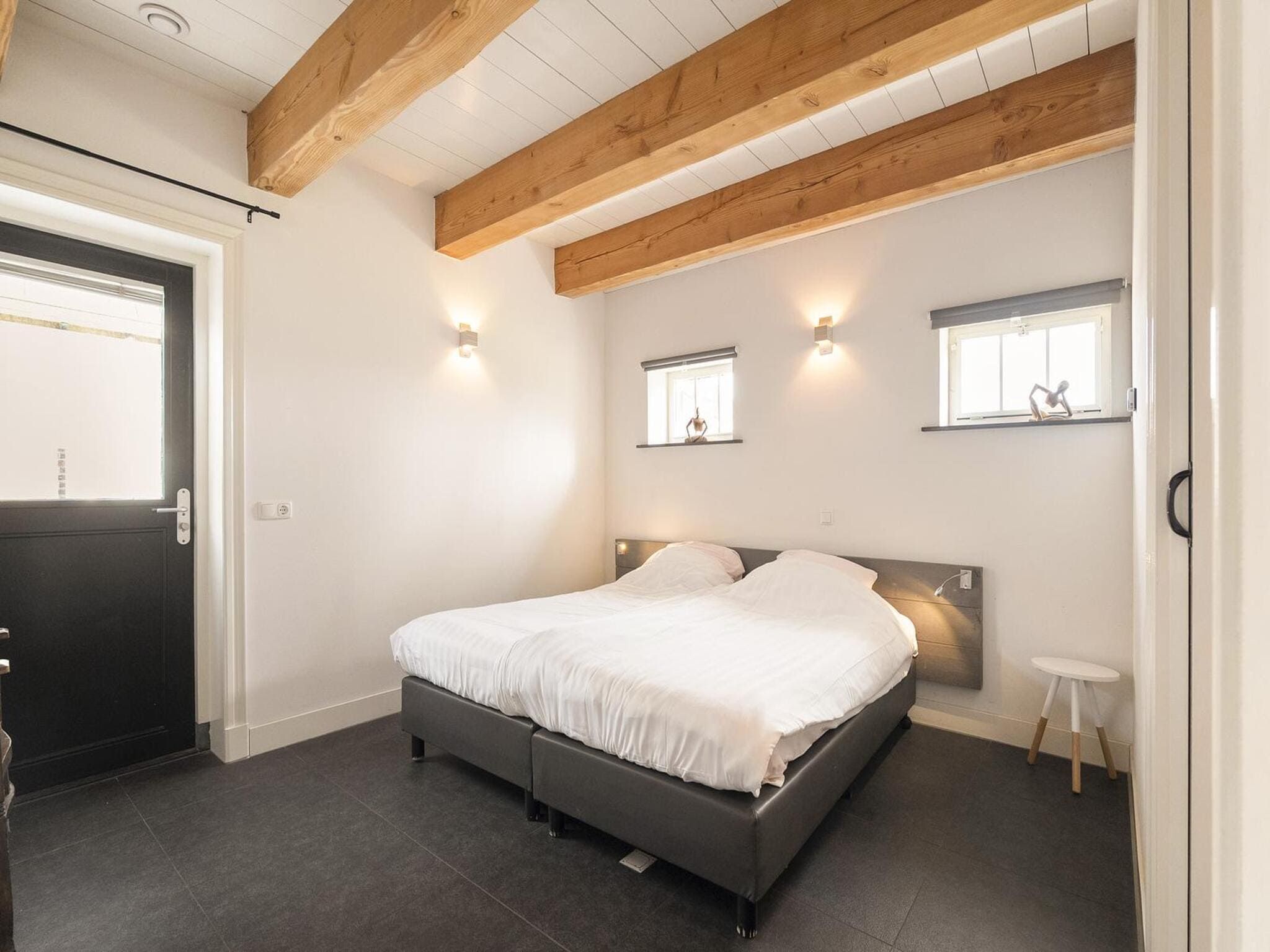 Een slaapkamer van Groepsaccomodatie - Balkenhoeve in Schagen