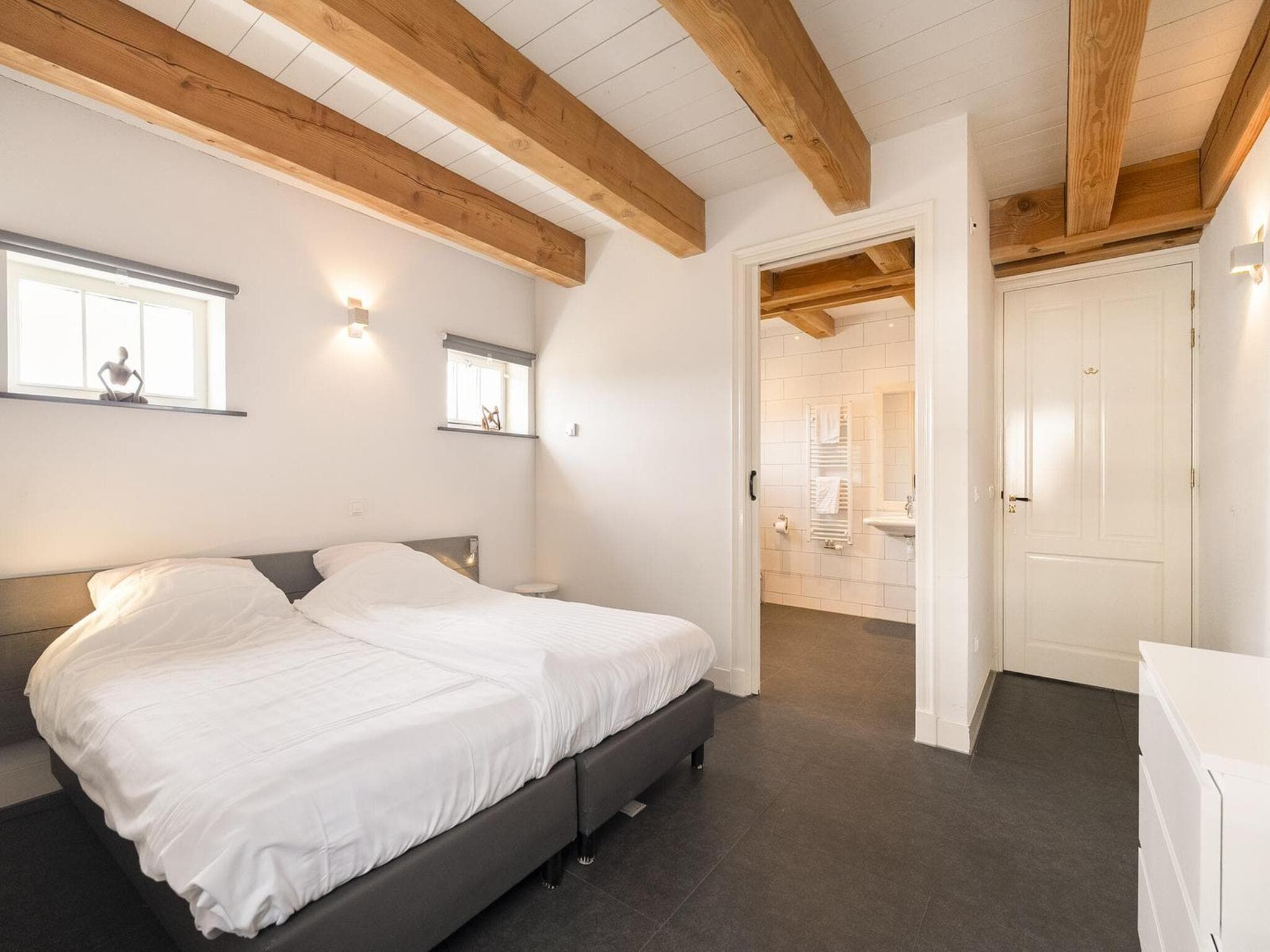 Een slaapkamer van Groepsaccomodatie - Balkenhoeve in Schagen
