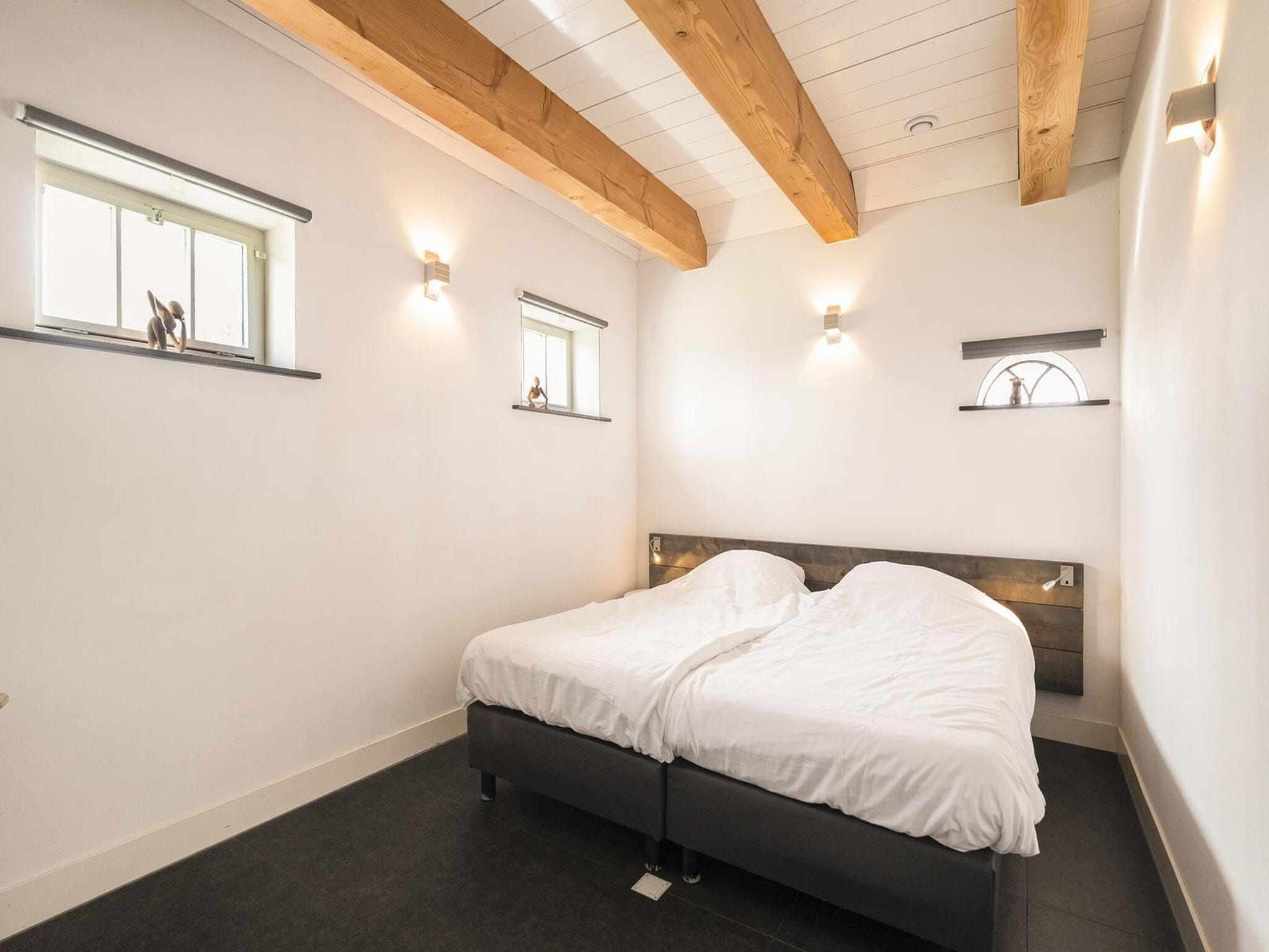 Een slaapkamer van Groepsaccomodatie - Balkenhoeve in Schagen