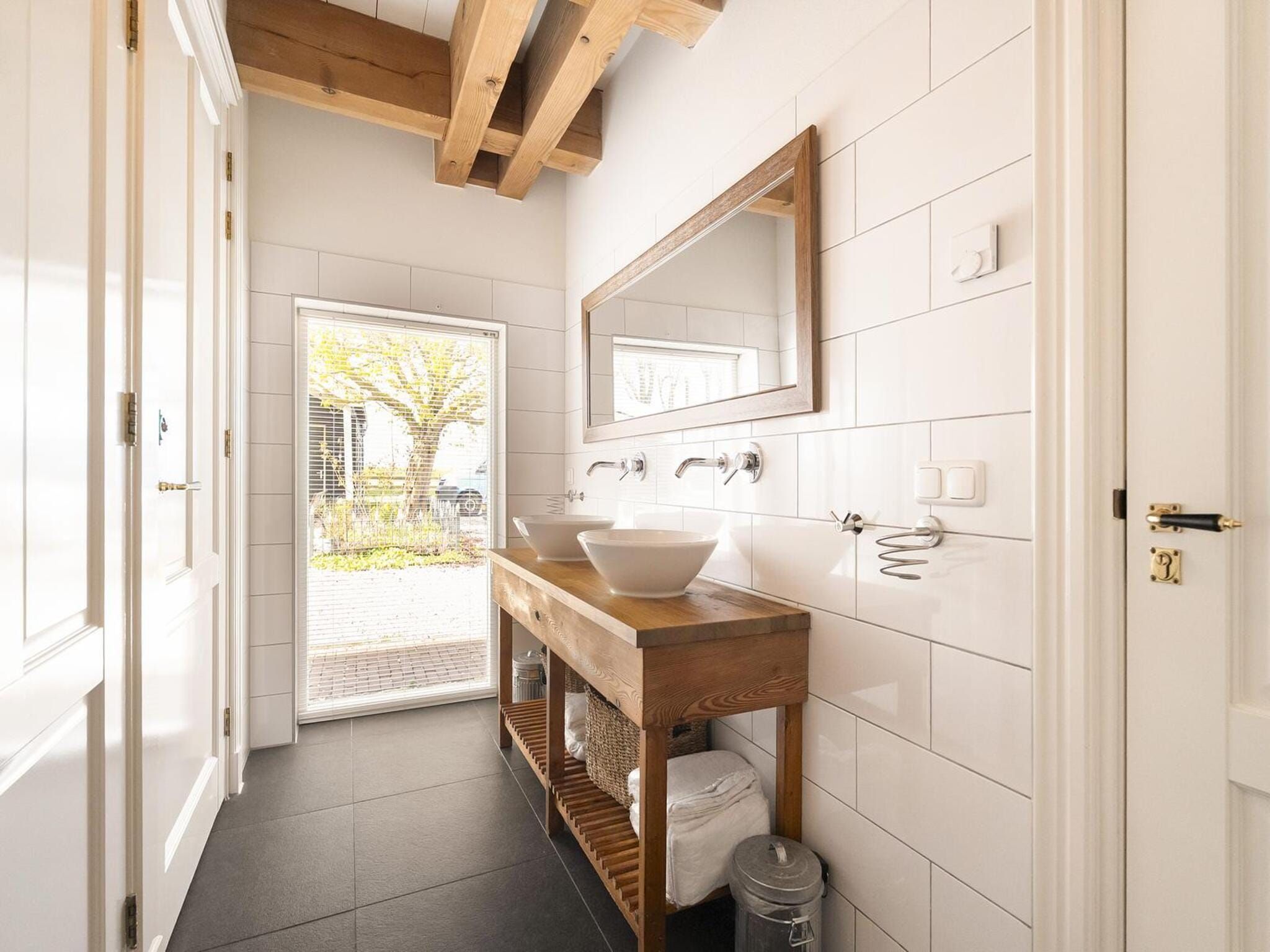 De badkamer van Groepsaccomodatie - Balkenhoeve in Schagen