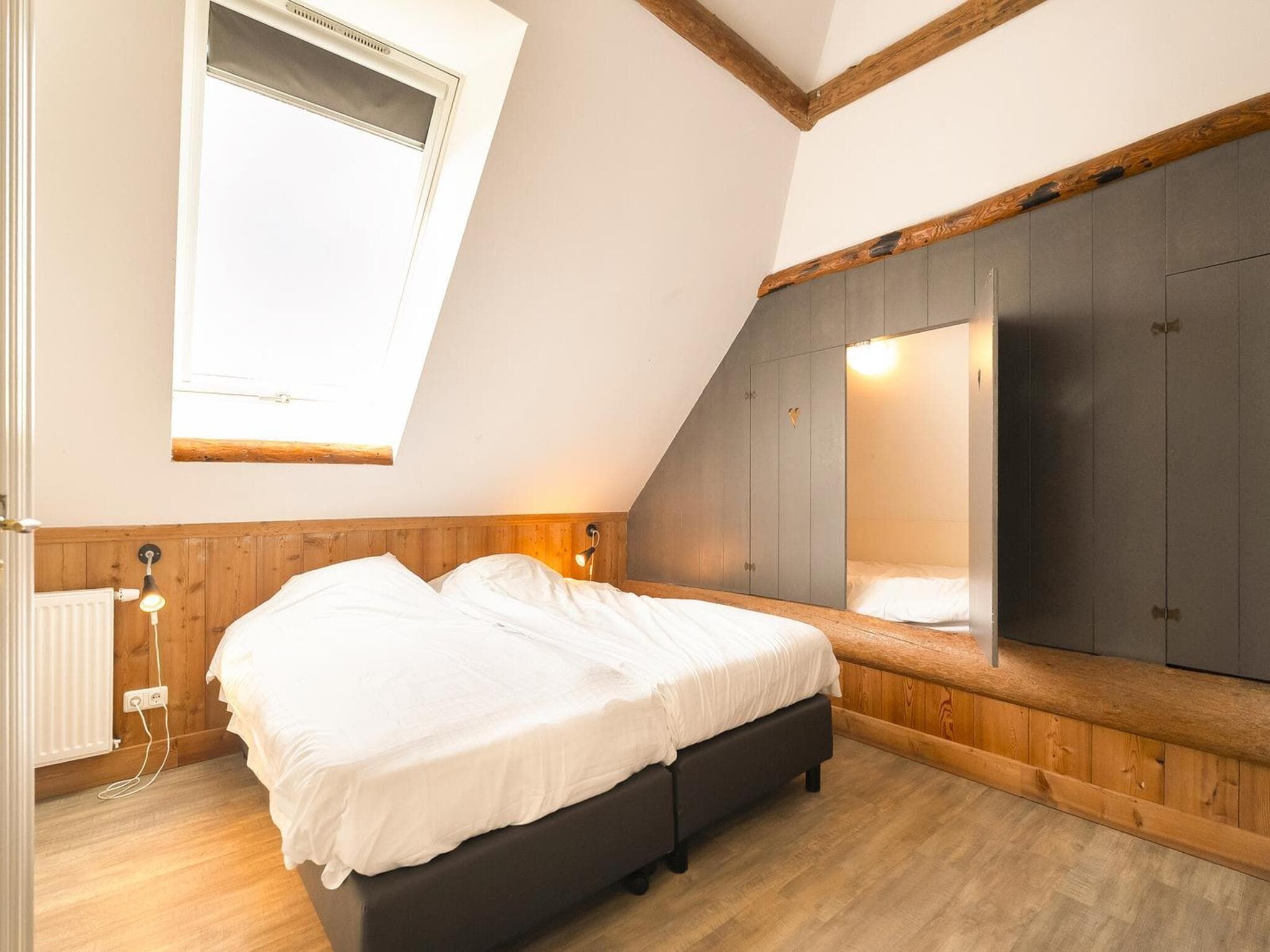 Een slaapkamer van Groepsaccomodatie - Balkenhoeve in Schagen