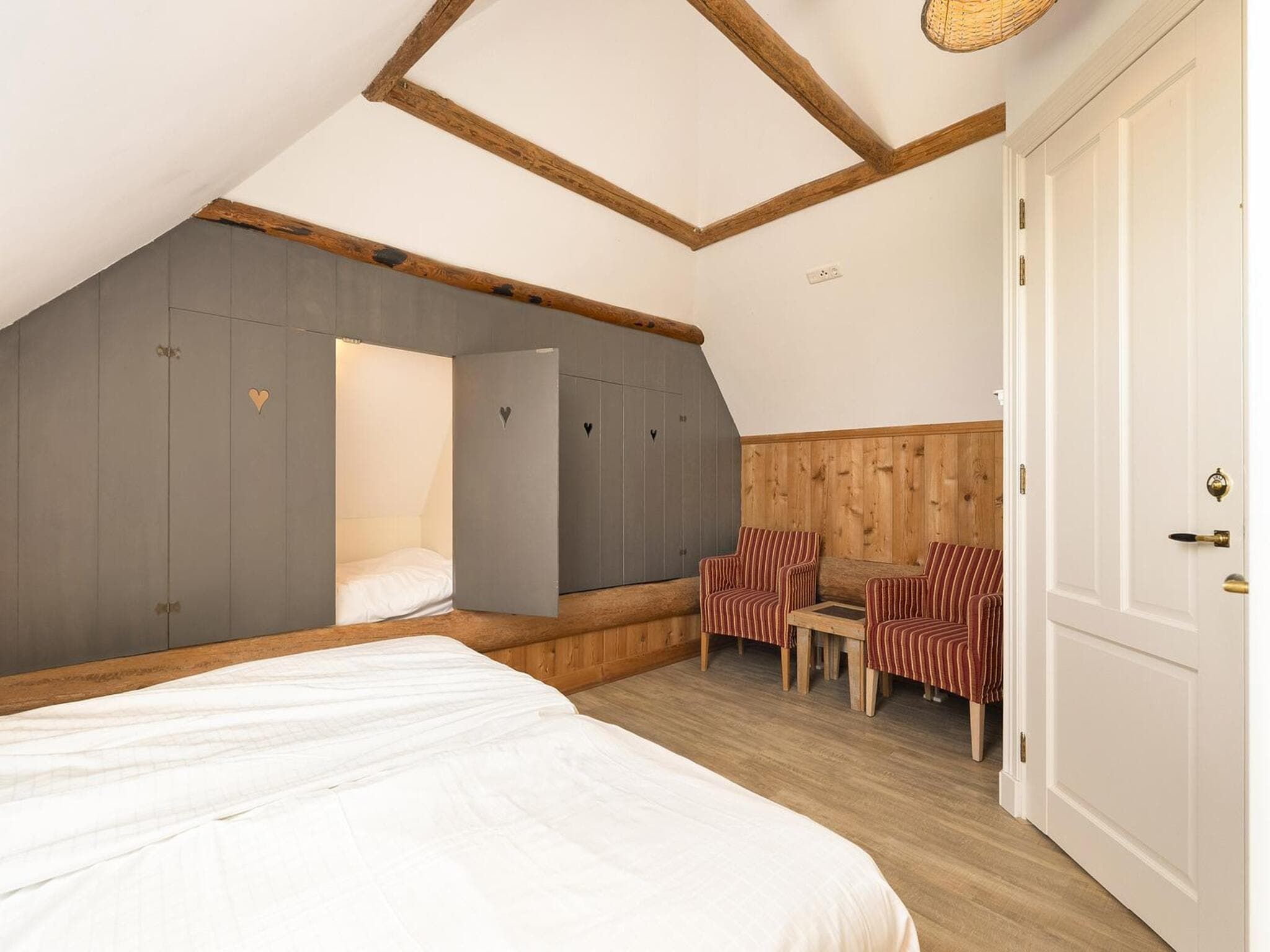 Een slaapkamer van Groepsaccomodatie - Balkenhoeve in Schagen