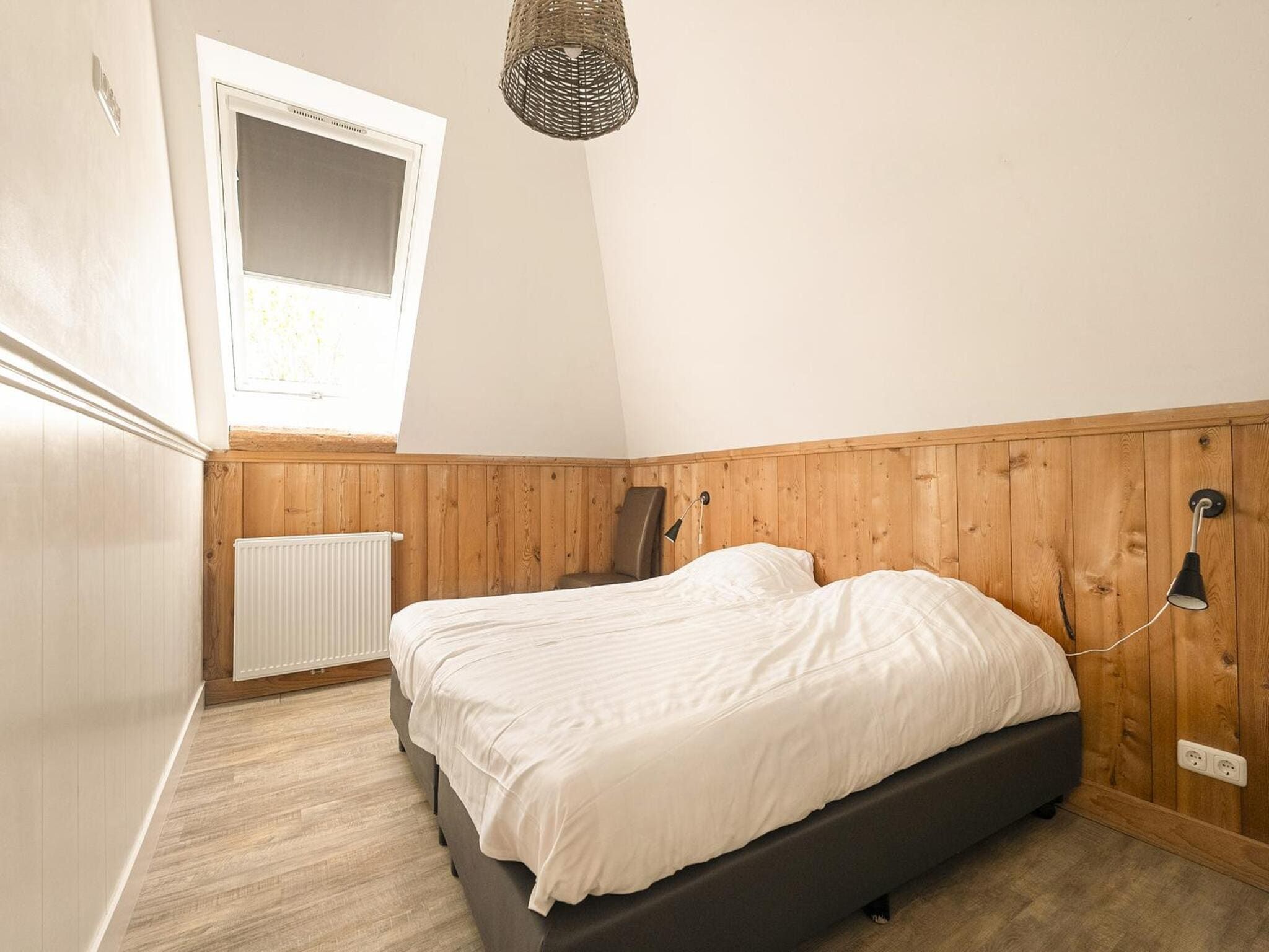 Een slaapkamer van Groepsaccomodatie - Balkenhoeve in Schagen