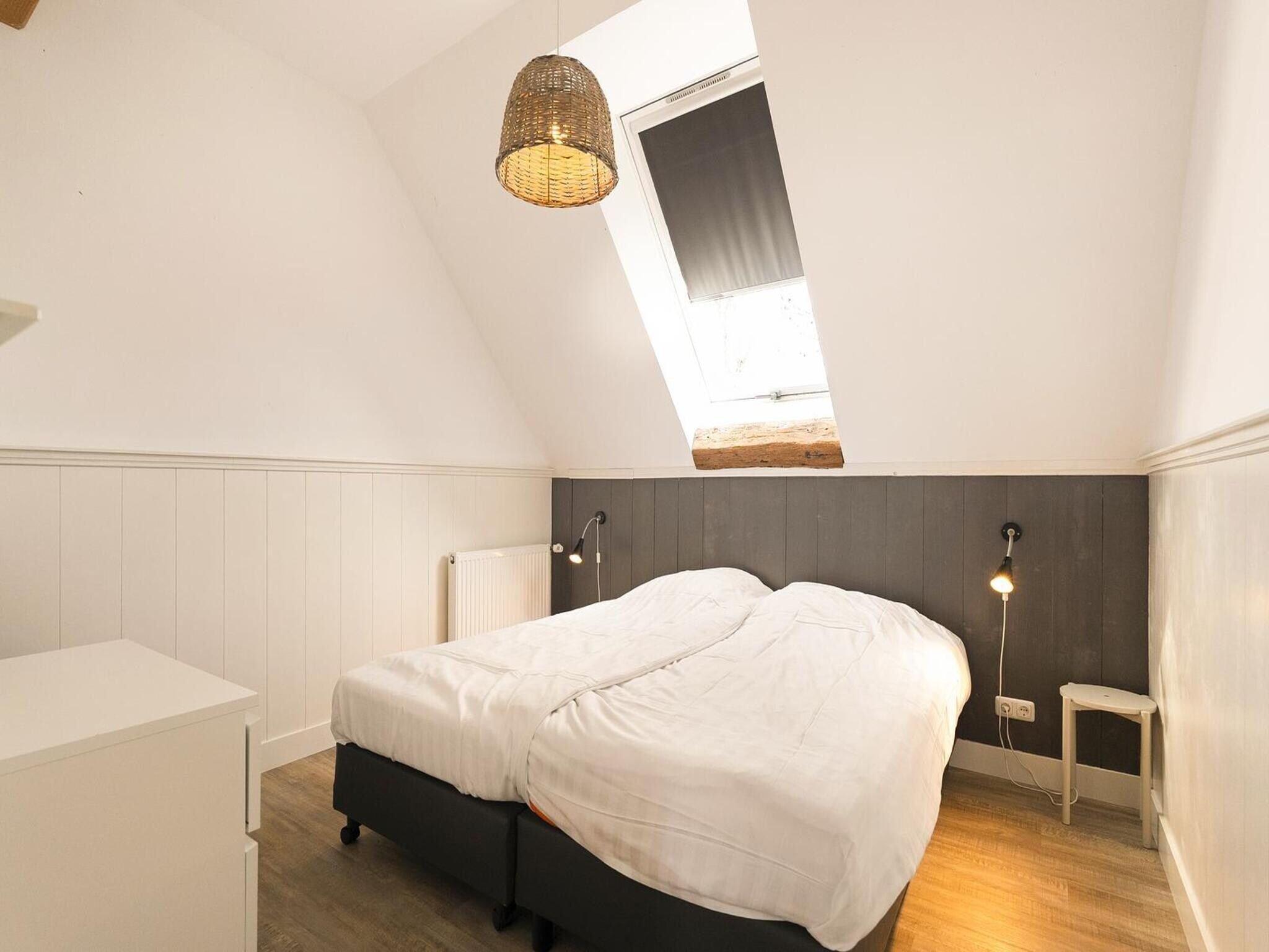Een slaapkamer van Groepsaccomodatie - Balkenhoeve in Schagen