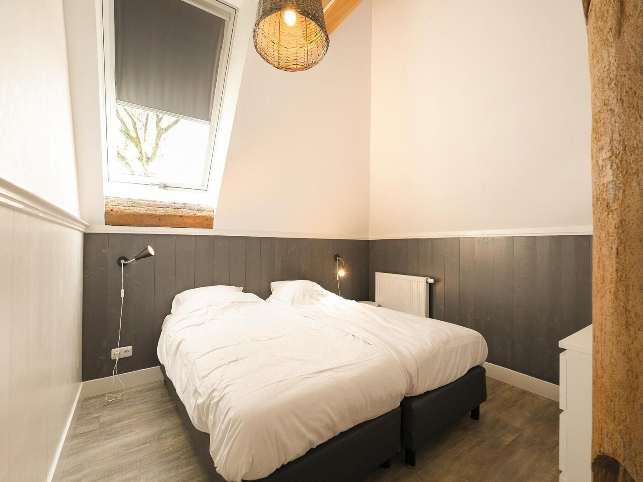 Een slaapkamer van Groepsaccomodatie - Balkenhoeve in Schagen