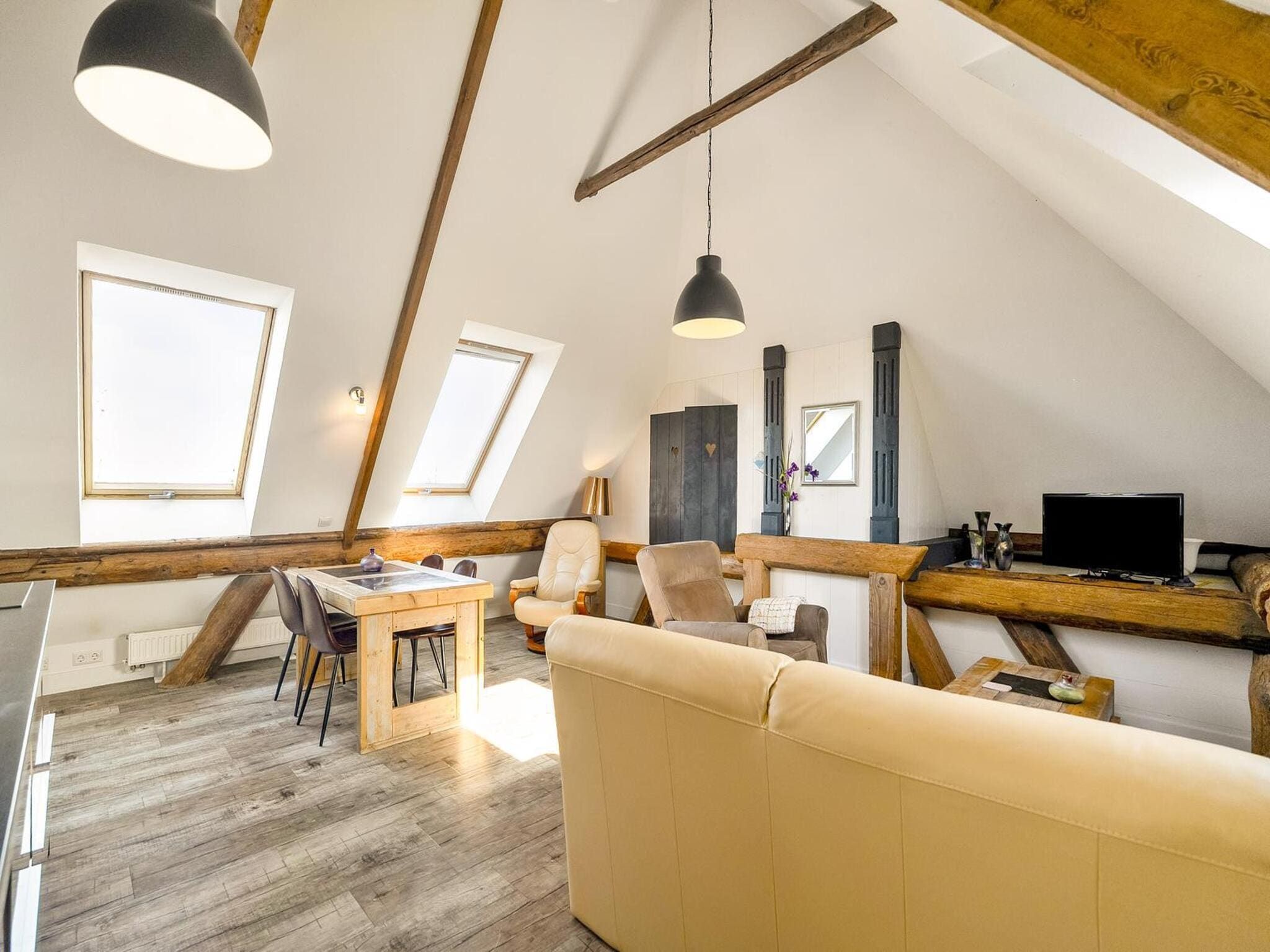 De woonkamer van Appartement Rustiek in Schagen