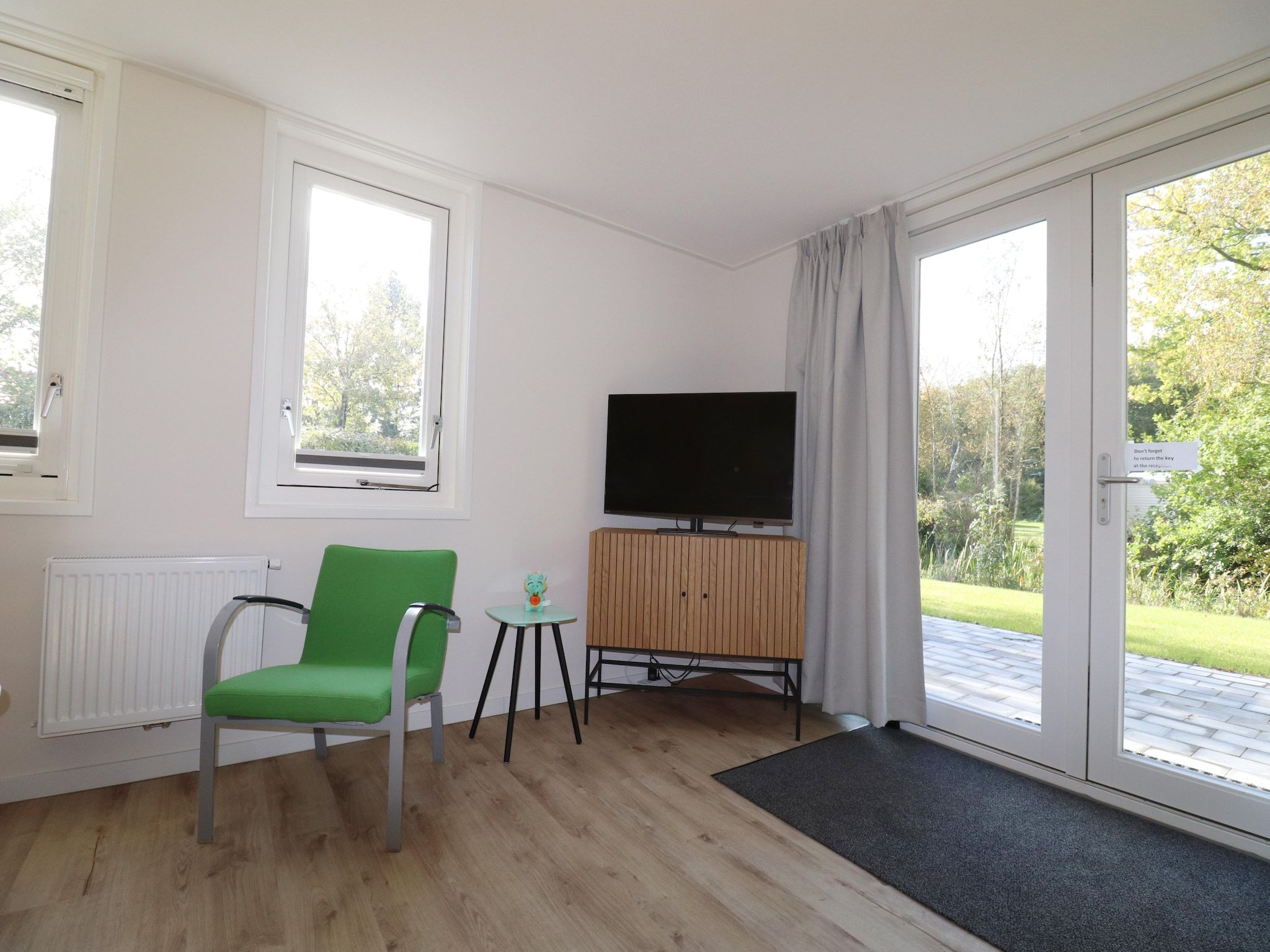 De woonkamer van Chaletwoning in Sint Nicolaasga