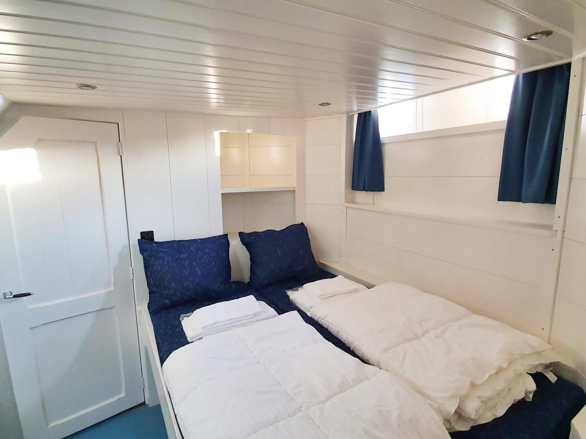 Een slaapkamer van De Zwerver Naarden in Naarden