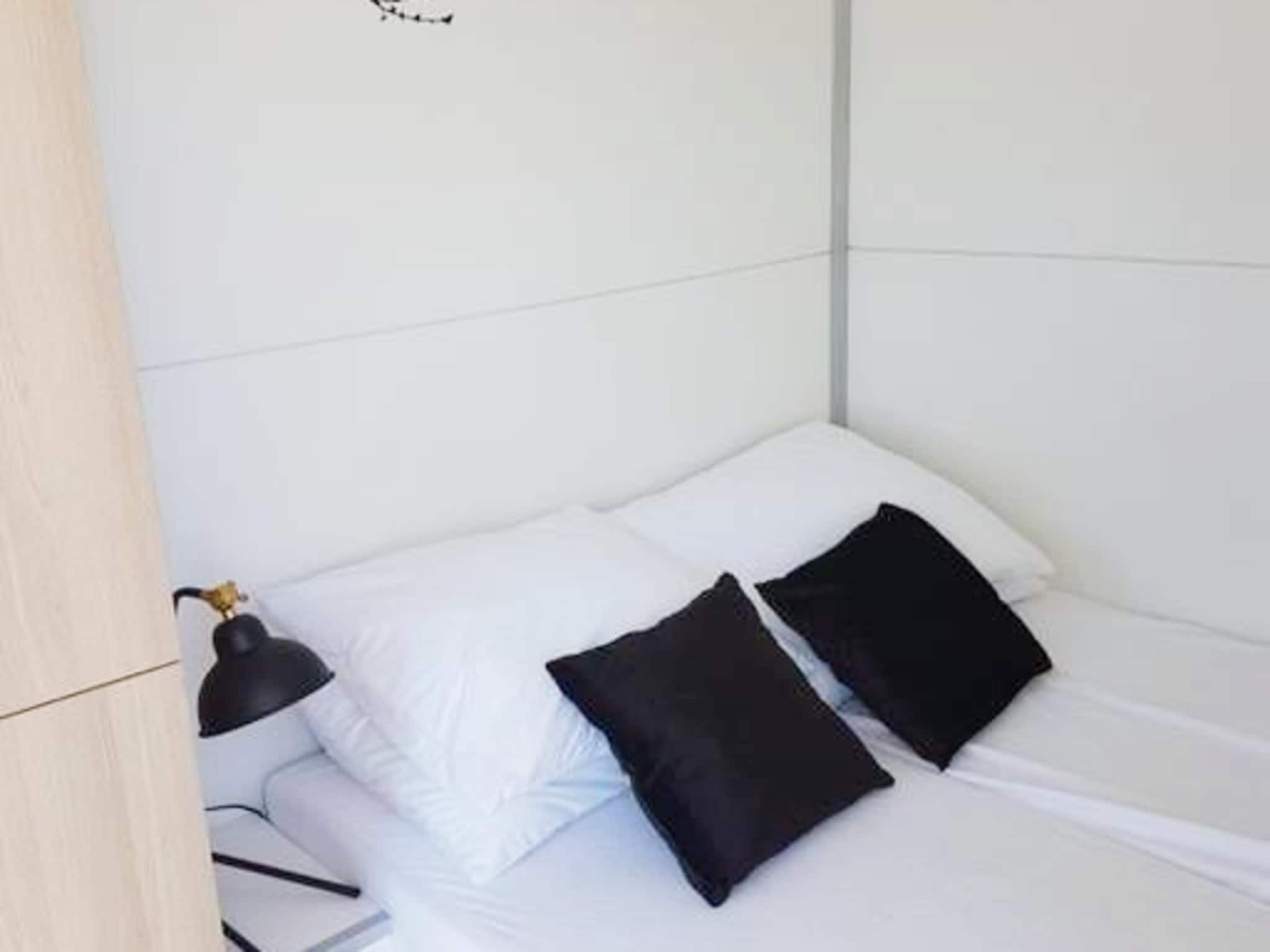 Een slaapkamer van Havenlodge with roof terrace and balcony (4 pers) in Amsterdam in Amsterdam