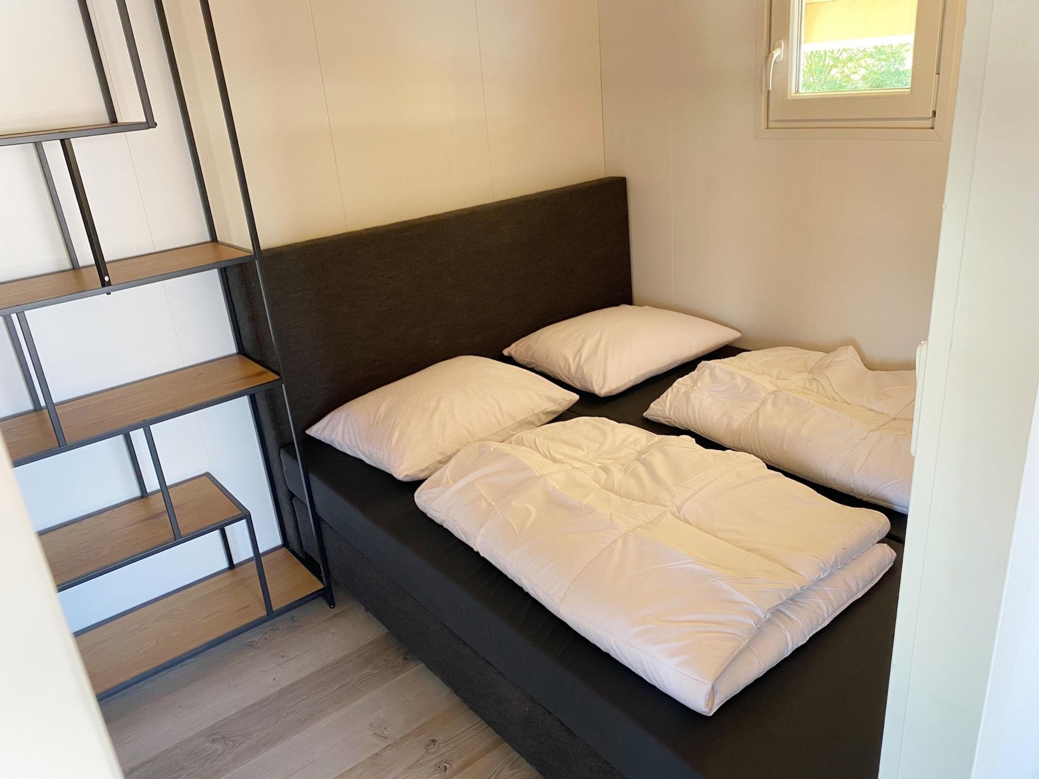 Een slaapkamer van Chalets in Almere