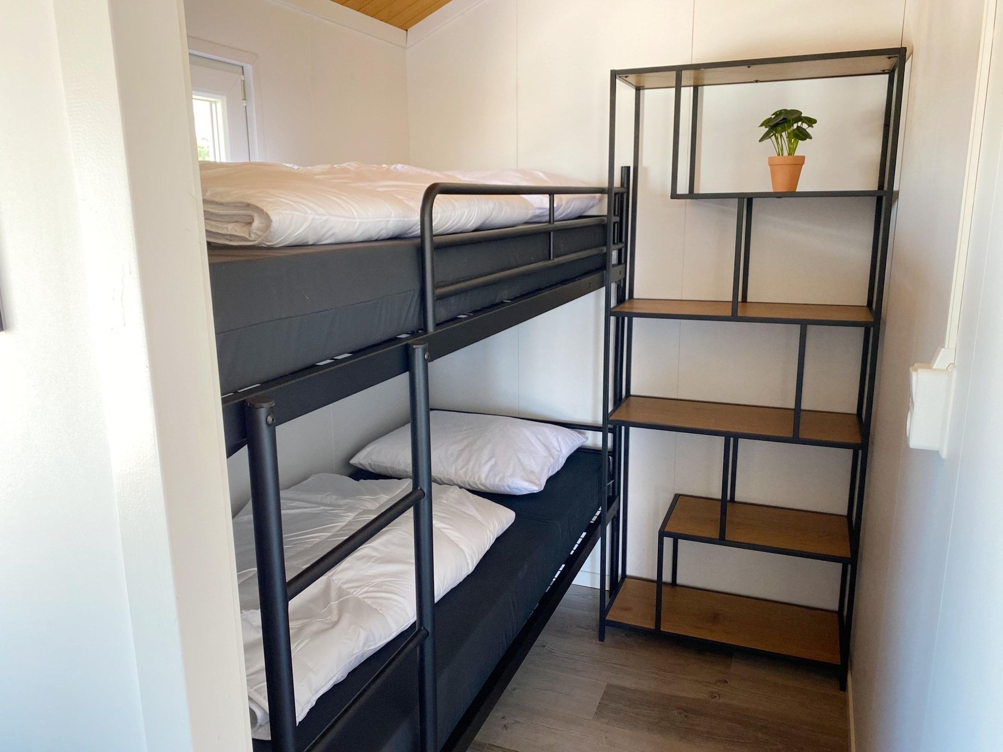 Een slaapkamer van Chalets in Almere