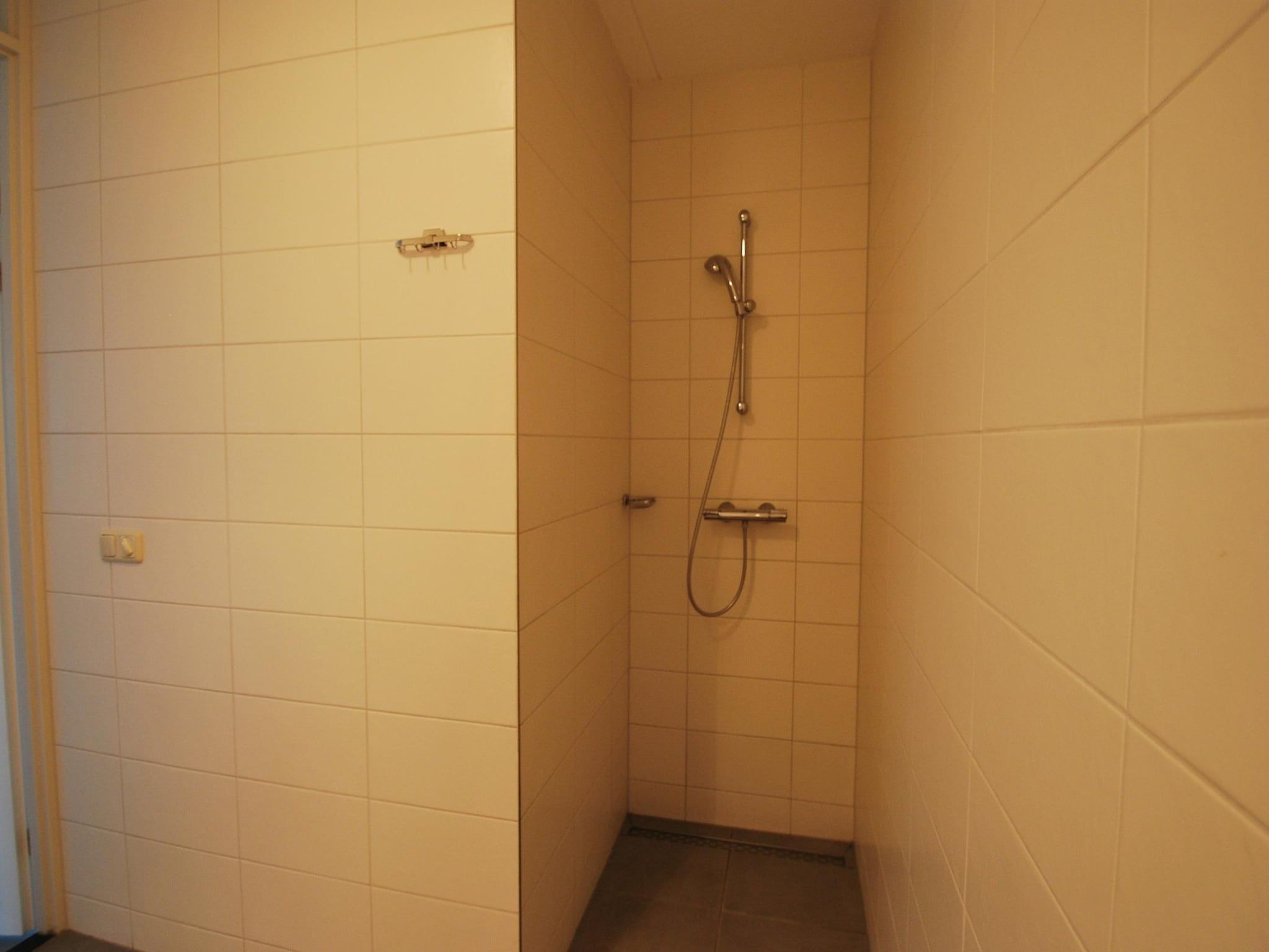 De badkamer van Beach Villa Royale Classic with Sauna - 10 persons in Makkum