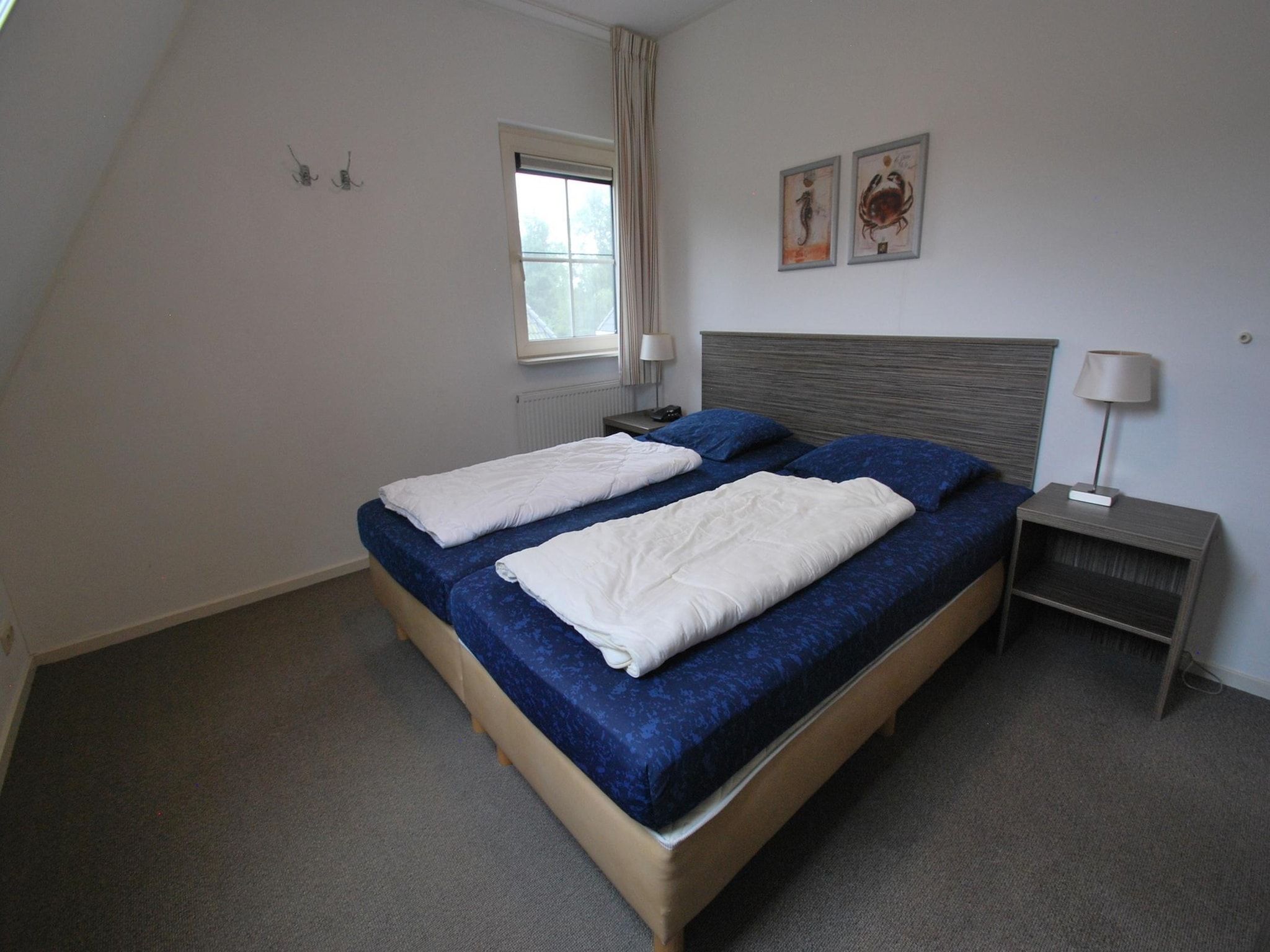 Een slaapkamer van Beach Villa Royale Classic with Sauna - 10 persons in Makkum