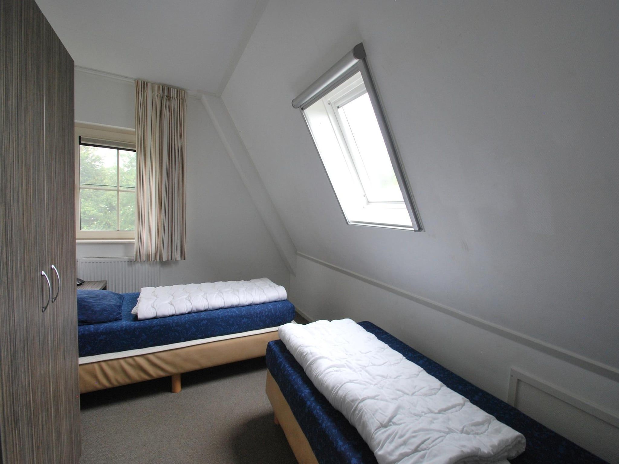 Een slaapkamer van Beach Villa Royale Classic with Sauna - 10 persons in Makkum