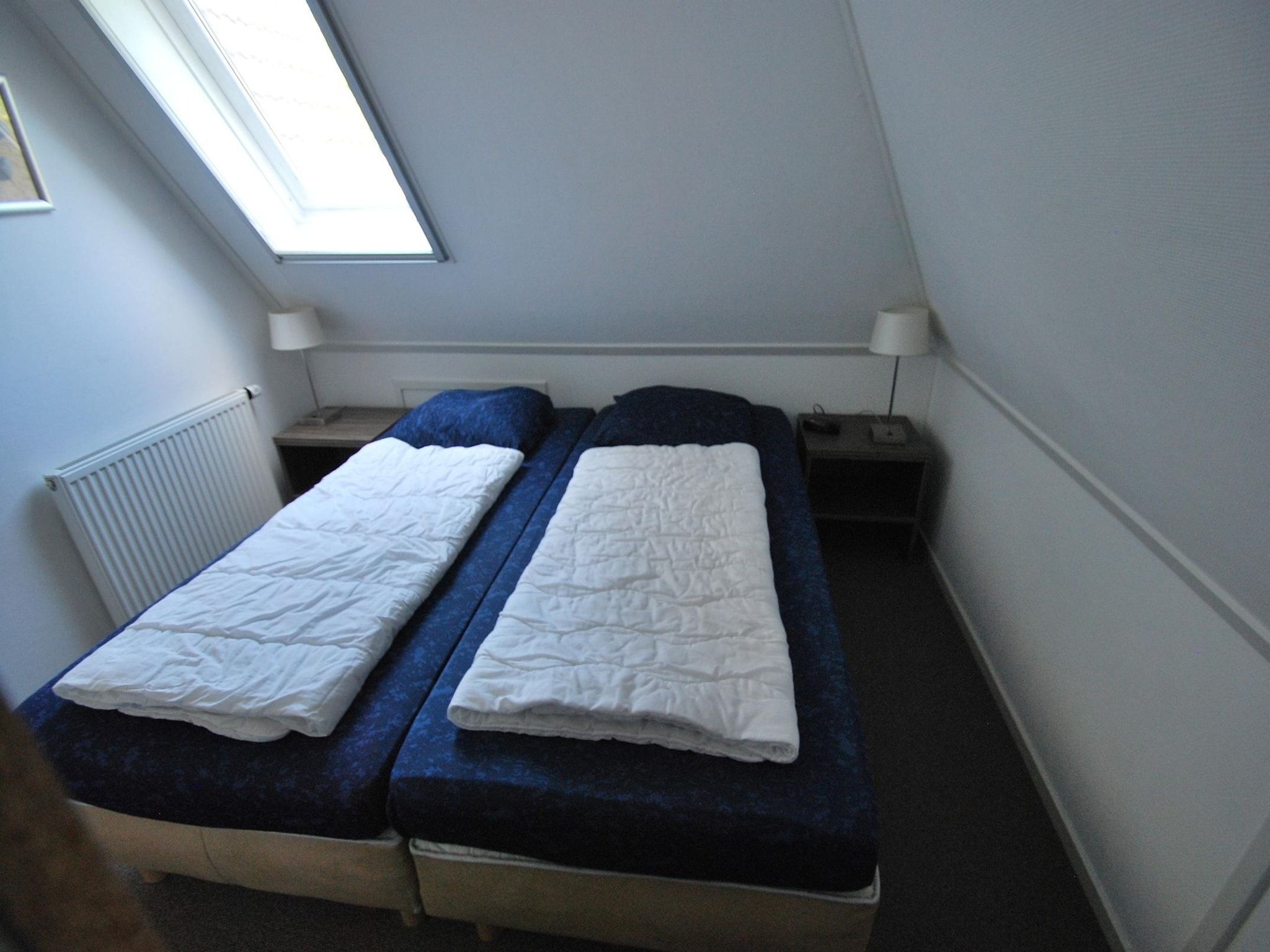 Een slaapkamer van Beach Villa Royale Classic with Sauna - 10 persons in Makkum