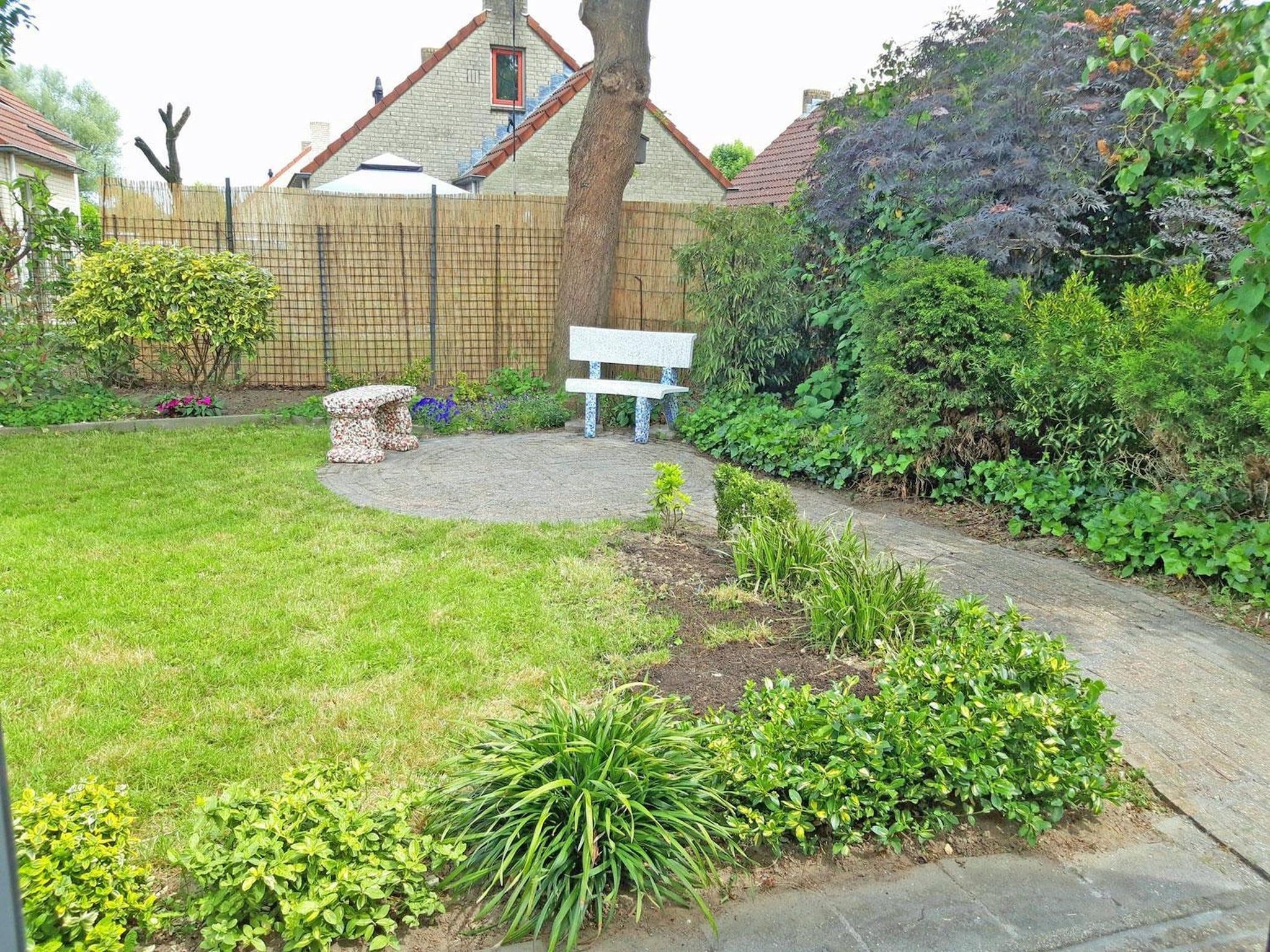 De tuin van 4-Persons Mi Casa in Ewijk