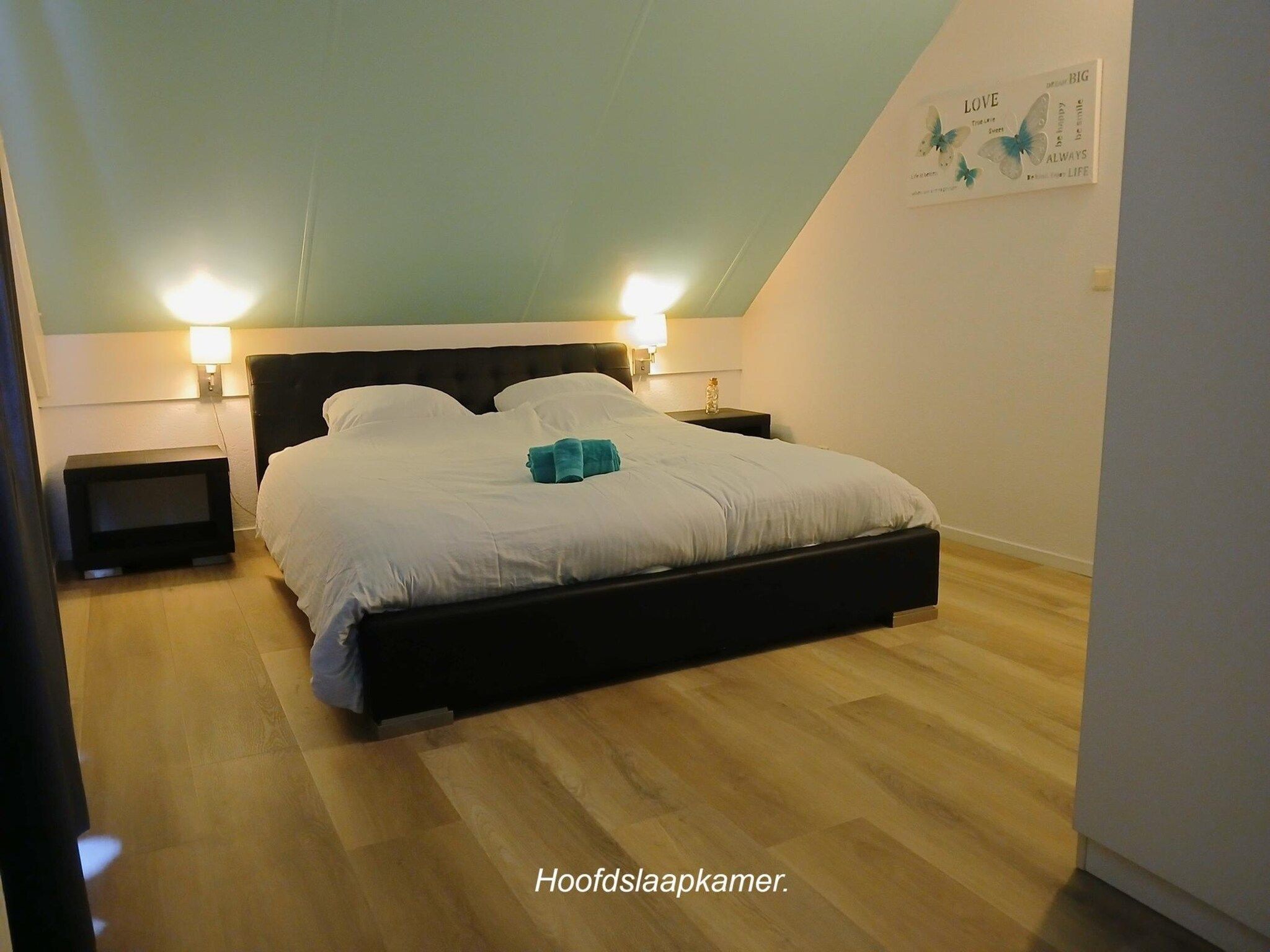 Een slaapkamer van 6 - Persons La Luna in Ewijk