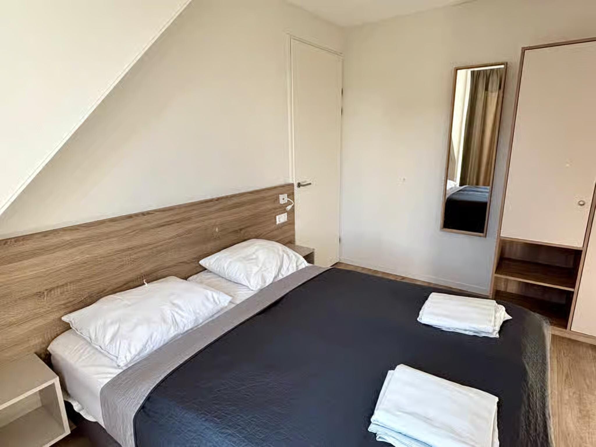 Een slaapkamer van Plein 40 Lodge 5 in Zoutelande