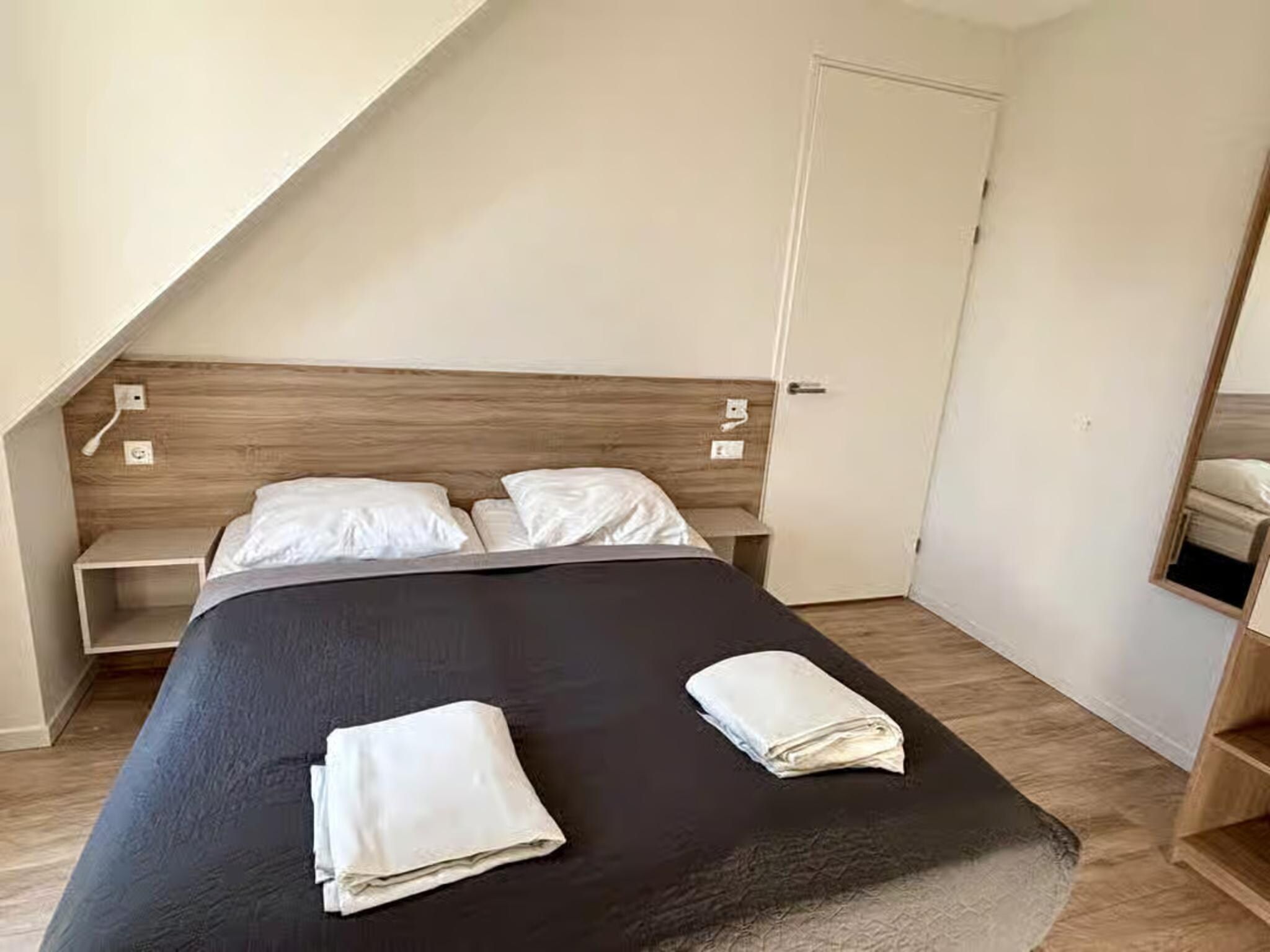 Een slaapkamer van Plein 40 Lodge 5 in Zoutelande