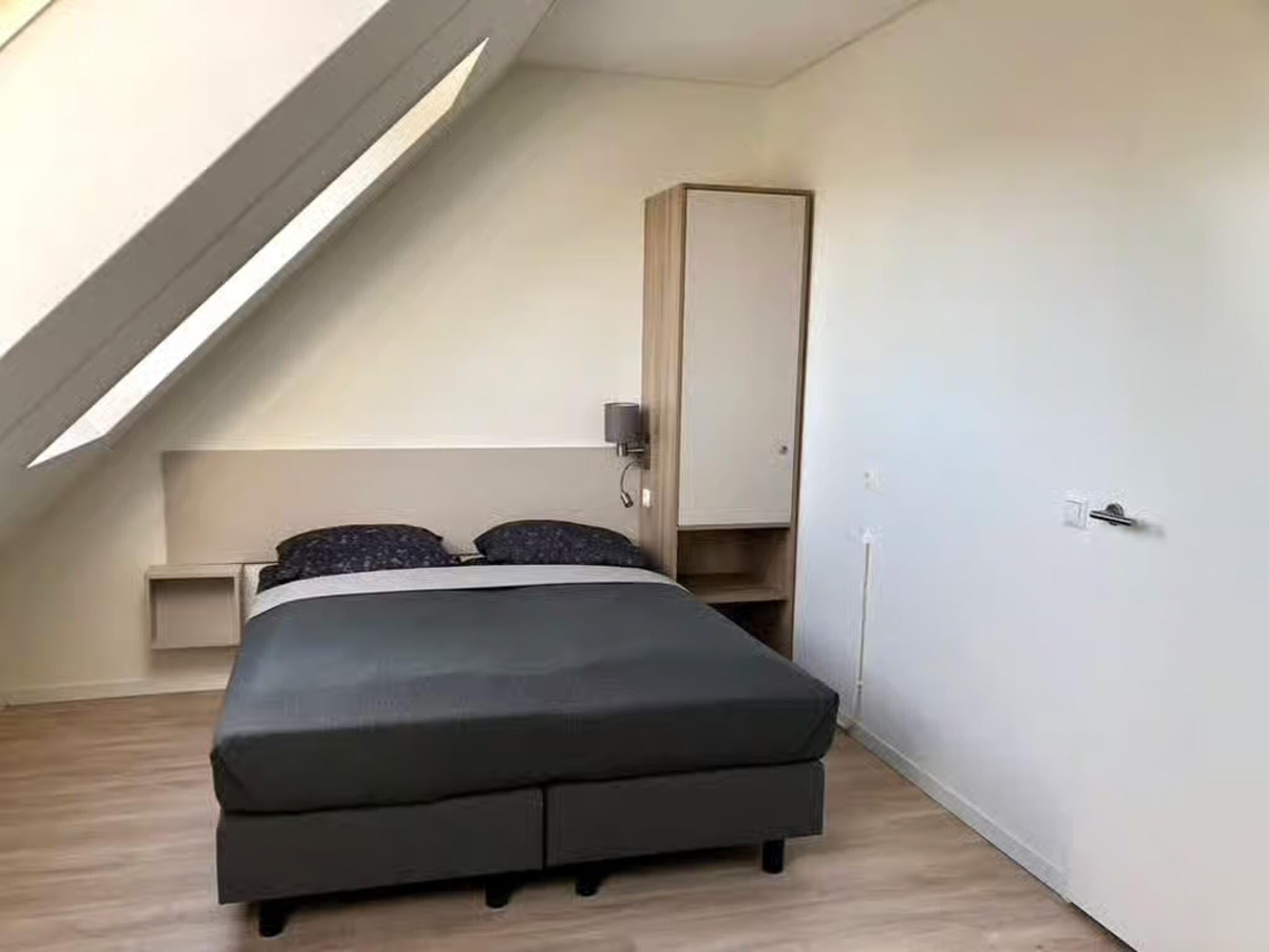 Een slaapkamer van Plein 40 Lodge 6 in Zoutelande